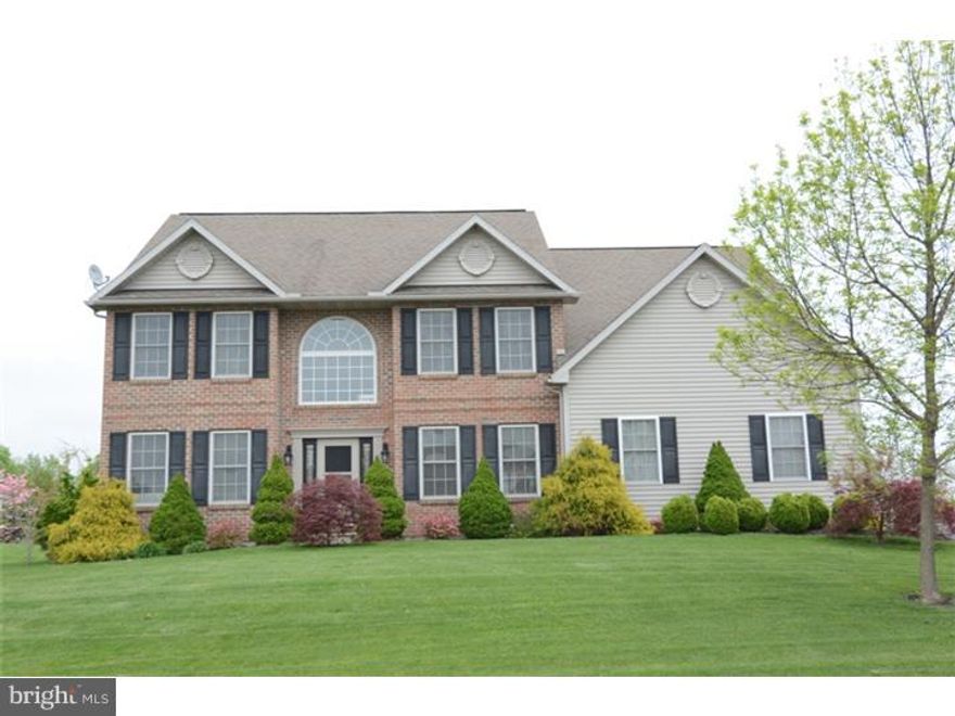 If you're looking for that special home that has everything already completed from top to bottom, look no further! Immediately upon entering you will notice the beautiful tiled floor, grand two story entrance, spectacular split staircase, and all the natural sunlight thru the many windows the home offers. Located just off the foyer is your formal living room, dining room, office/den area. The two story great room with beautiful gas floor to ceiling stone fireplace is absolutely stunning! The large eat in kitchen boasts 42" cabinets, large custom island, and tile flooring. Conveniently located just off the garage entry is your main floor laundry and nice sized mudroom. On the upper level you will be enamored with the ability to overlook the main floor from the catwalk leading to the master suite of your dreams. Oversized bedroom with sitting area, master bath with Jacuzzi tub, stall shower and large walk in closet. Three more generous sized bedrooms and another full bath complete this area. No expense was spared when finishing this gorgeous Lower Level which adds over 1,000 Sq./Ft. of living space with plush carpeting, hardwood flooring, custom lighting, built in area for television and media center, large wet bar, full bath, and pellet stove make this a wonderland for entertaining all year long. The entertainment doesn't stop there. The exterior is professionally landscaped  and the rear boasts an absolutely gorgeous enclosed brick patio area with fenced "FRONHEISER" in- ground pool. Large flat yard with oversized shed to store more than enough lawn equipment, also is powered with its own separate electric service. This home has too many upgrades to list, but must be seen to be truly appreciated. Schedule your showing today, this one will not last!