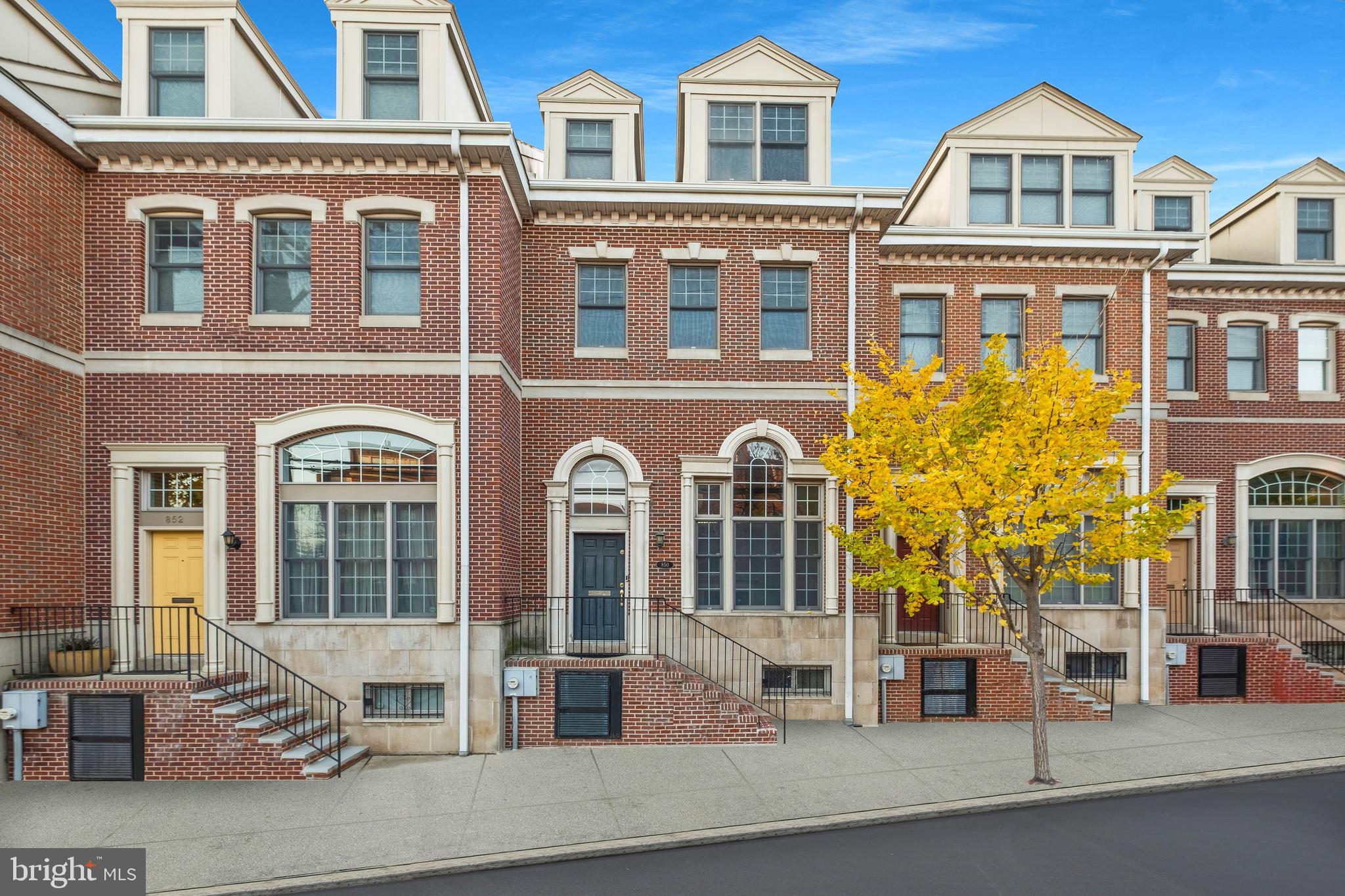 This sprawling Queen Village 3 bedroom, 3 1/2 bathroom home  with garage parking is a must see!  Dramatic living room with 15 ft ceilings and a fireplace that greets you upon your entry. Perfectly designed cooks kitchen and dining area with a Juliet Balcony. Is so nice that your open concept dining/kitchen area is OPEN and OVER LOOKS your living area! Third floor boasts two closets and a tile bath. Top floor primary suite is enormous and features a walk in closet, ensuite tile bath plus an additional area leading out to your private deck. There is also a finished lower level which is an ideal in home office, gym, or kids play room. This unique community just off Christopher Columbus Blvd. offers EZ access to I95, the Ben Franklin Bridge, Cooper Hospital, and of course the new Giant Super Market.