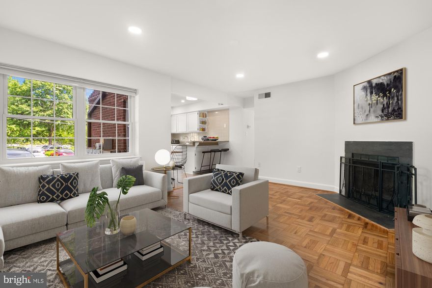New Listing!  Welcome to North Arlington's best kept secret! Spacious and bright 2BR with on-site PARKING, a generous storage unit, in-unit W/D, hardwood floors, sparkling white eat-in-kitchen with stainless steel appliances and breakfast bar, and wood-burning fireplace in quiet, park-like setting. Less than a mile to Rosslyn and Courthouse Metros. Walk to Clarendon, Georgetown, everwhere! Low-fee is just $396/mo. This home has been lovingly cared for, and is move-in ready. Hurry! Easy access to Reagan National Airport, Rt. 66, GW Parkway and all major commuter routes. Pets are welcome! Adjacent to parks, trails, and lots of green space, yet minutes to all the action. Yes, you really can have it all!
