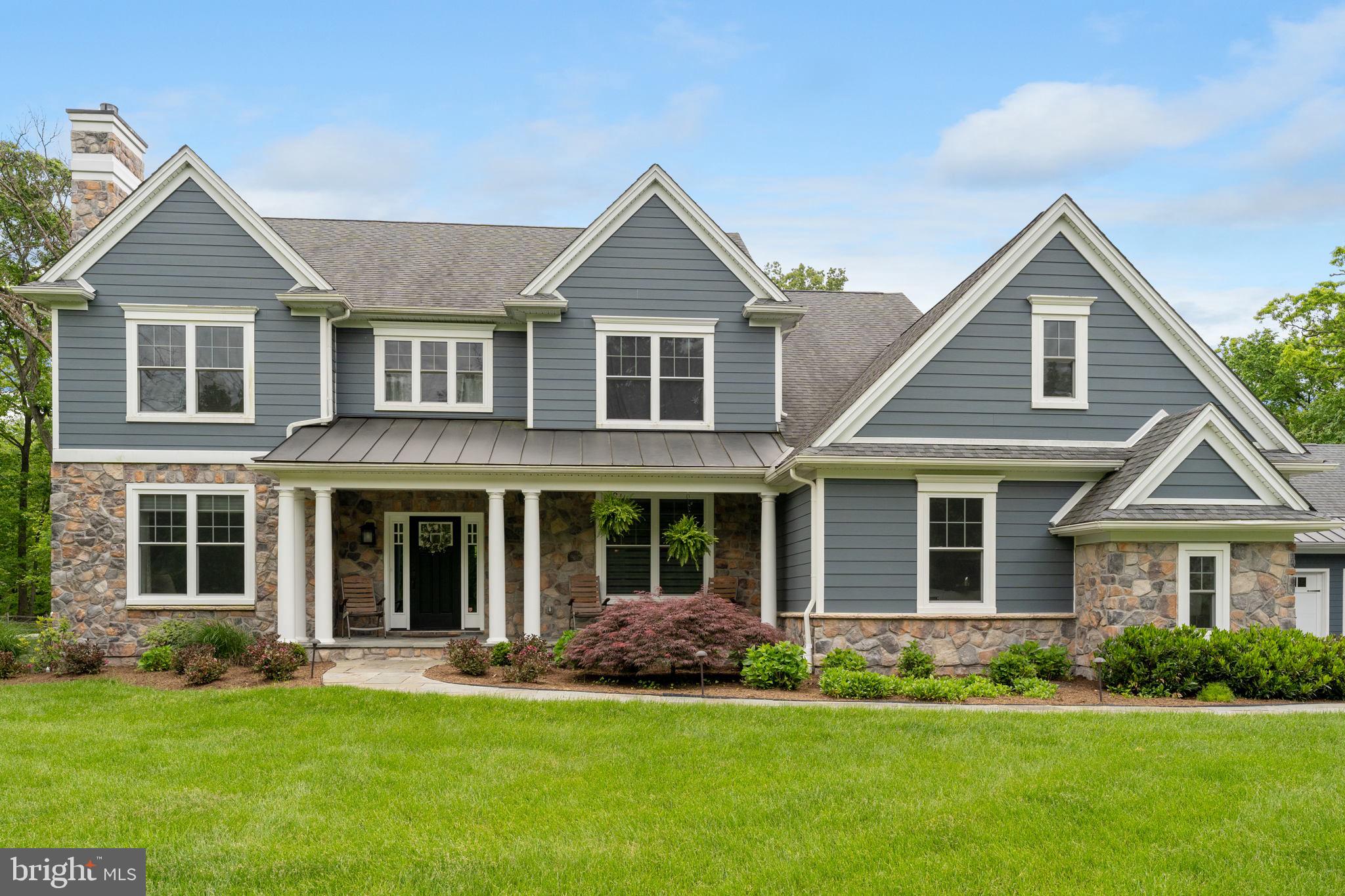 Welcome to 11 Andrews Road, located in popular Willistown Township. This beautiful, 7-year-old colonial presents 4 bedrooms (possible 5th bedroom on the lower level), 4 full bathrooms and 2 powder rooms with a 3-car oversized attached garage AND a 2-car heated, detached garage with plenty of storage space on the second floor! If you’re a car enthusiast and looking for a spectacular 2-acre lot, you won’t want to miss this opportunity. Follow the blue stone walkway to the front porch and step into the center hall. The formal dining room with wainscoting and coffered ceiling is on your right. Left is the French doors to the all-important home office (or den) with gas fireplace. Through the dining room you’ll pass through the Butler’s Pantry with convenient wet bar and upper display cabinets along with the spacious kitchen pantry. Continue through to the heart of the home, the kitchen, open to the family room and breakfast room overlooking the beautiful back yard. The kitchen is complete with large quartz-top island and 4-stool breakfast bar with pendant lighting, stainless appliances, propane cooking and 42” cabinets. The adjoining family room focuses on the raised hearth, wood-burning fireplace and also offers a ceiling fan, recessed lighting, and built-in cabinets. The family style breakfast room has windows and sliding doors to the rear living space. Back off of the kitchen is the large mudroom with cubbies, tile floor, and informal powder room. Most of the 1st floor offers hardwood flooring and is completed by the coat closet and formal powder room just off of the front hall. Upstairs you’ll find the primary bedroom with tray ceiling & ceiling fan. The beautiful en suite bath has a large oversized shower, soaking tub and double vanities. The large “u-shaped” master closet provides lots of hanging space and through the closet is a large unfinished attic storage space. Bedrooms 2 and 3 share the Jack & Jill tiled bathroom. Bedroom 4 is the princess suite with its own en suite bathroom. The lower level is finished into a great entertaining TV/game area with custom-built wet bar with full size refrigerator and plenty of recessed lighting. There are also 2 finished rooms for the potential 5th bedroom and another home office along with the 4th full bedroom. Part of what makes this property so special is the spacious level backyard and fantastic outdoor living and entertaining space which includes a deck with steps down to the blue stone patio, pergola seating area, covered outdoor kitchen & bar and the firepit area with built-in seating as well as a beautiful waterfall and koi pond. This fantastic property is conveniently located in the award-winning Great Valley School District and is minutes from Malvern Borough shops and restaurants as well as the Malvern Train Station.
