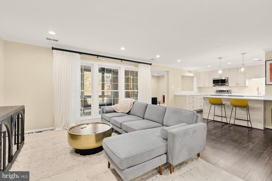 *Offer Deadline, TUES March 18th, 2PM * Welcome Home to Tuckerman Station! Discover this rarely available two-bedroom, two-bathroom condo with a den and an all-seasons sunroom in the highly sought-after Tuckerman Station community. Designed with an open-concept floor plan, this inviting home boasts recessed lighting, an in-unit washer/dryer, and thoughtful updates throughout. The beautifully renovated kitchen features quartz countertops, stainless steel appliances, and a stylish breakfast bar, seamlessly flowing into the welcoming living area—perfect for entertaining. The cozy den, complete with a wood-burning fireplace and mantel surround, offers the ideal space for relaxing or working from home. Step into the enclosed sunroom, a true all-season retreat with ceramic flooring, floor-to-ceiling Anderson windows, and an oversized storage closet equipped with shelving and built-ins. The spacious Owner’s Suite features a walk-in closet and a remodeled en-suite bath with Kohler fixtures and soaking tub. The generously sized second bedroom sits adjacent to the updated hall bath, complete with accent wallpaper and a walk-in shower with a built-in bench. Live moments from PIKE & ROSE, where you’ll find fantastic dining, shopping, and entertainment. Less than one mile from the Grosvenor-Strathmore Metro, with easy access to Strathmore Arts, Whole Foods, Starbucks, Seasons 52, and more—all conveniently connected by the Bethesda Trolley Trail. Plus, with quick access to I-270 and I-495, commuting is a breeze. New HVAC (2023). For added convenience, the unit conveys with 1 assigned parking space and there are two EV charging stations adjacent to the building. Experience city convenience in a tranquil suburban setting—welcome home!