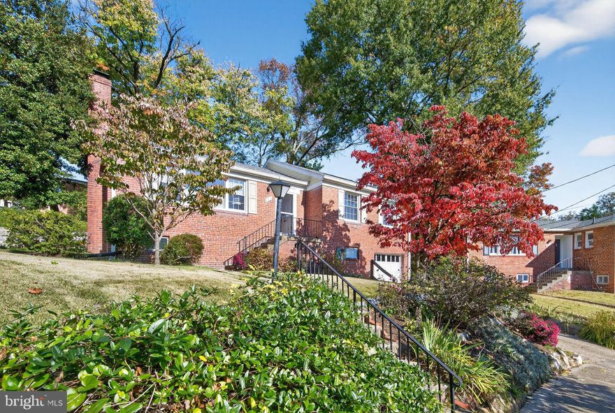 Welcome to 402 Hinsdale Ct, a meticulously cared-for raised home on a quiet cul-de-sac in Highland View. This delightful raised ranch offers a perfect blend of comfort and style. Built in 1951, this brick home has been lovingly maintained and boasts excellent condition throughout. With 1,922 sq. ft. of living space, it features three spacious bedrooms and two and a half bathrooms, providing ample room for relaxation and privacy. Step inside to discover beautiful hardwood floors that flow seamlessly through the main living areas. Cozy up by the wood-burning fireplace in the inviting living room, perfect for chilly evenings. The partially finished basement offers endless possibilities, whether you envision a playroom, home office, or additional guest space. The owners have thoughtfully upgraded the majority of the major systems including 30-year architectural shingle roof & siding (2017), new Bosch boiler (2020), new water heater & electric stove (2024), upgrade main service cable (2016) and rewired bedrooms (2022). Refinished original hardwood floors, updated windows, and efficient dual-zone radiator heat with upper-level central AC provide for comfortable, worry-free living while you add your own personal touches. Professionally terraced backyard with custom landscape design. Bonus workspace off attached garage. Back porch has been completely refurbished (2023) with new insulation and walls. Conveniently located close to parks, schools, and major highways and just minutes to downtown Silver Spring.