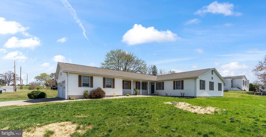 This home features almost 2000 square feet of living space all on one level.  The rooms are large which includes 2 family rooms, 4 bedrooms, separate laundry room/mud room, oversized attached 2 car garage, large kitchen with plenty of cabinets and stainless-steel appliances and a separate dining room.  The master bedroom has 2 closets and an attached full bathroom.  There is also a hall bathroom with double sinks and an additional 1/2 bath.  The house has been professionally painted and new LVP flooring was just installed throughout.  There is a large deck off the back of the house and the back yard is fully fenced.  The roof is only a few years old and there are 2 pellet stoves for an additional heat source.  There is no HOA and only county taxes.