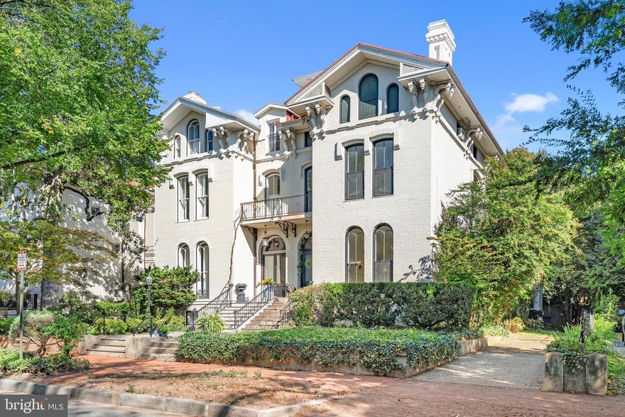 A rare Georgetown treasure, this Italianate Villa residence stands proudly along distinguished Cooke’s Row on Q Street. Built in 1868 as one of eight grand homes commissioned by financier Henry Cooke, the semi-detached Victorian embodies architectural pedigree, scale, and enduring historic character.

Set on a 5,878-square-foot lot with more than 7,695 square feet of interior space, the residence offers 7 bedrooms, 6.5 baths, and surface parking for two or more cars with a private driveway. Preserved in the same remarkable condition for over 80 years, it retains its integrity while presenting opportunities for thoughtful restoration.

The main level, with soaring 14-foot ceilings, showcases some of the most beautiful and intact original details in Georgetown—gracious moldings, arched windows, wood-burning fireplaces, hand-carved mantels, and a bespoke staircase that serves as a stunning centerpiece uniting all floors. Grand entertaining spaces reflect the home’s storied past and timeless elegance.

Upstairs, the sun-drenched primary suite overlooks tree-lined Q Street and features an elegant en-suite bath and wood-burning fireplace. Three additional bedrooms complete this level, including the distinguished “Thatcher Suite,” where former British Prime Minister Margaret Thatcher resided after leaving office. The third floor offers additional bedrooms and a full bath, with access to the dramatic fourth-floor cupola boasting sweeping water views over the Georgetown skyline. The expansive lower level includes a full apartment and abundant storage.

Beyond the interiors, the property features a coveted private driveway with off-street parking for two cars, as well as a generous rear garden - an ideal setting for gardens, terraces, or outdoor entertainment.

A true grande dame of Georgetown, Villa No. 3 of Cooke’s famed “Row of Eight” stands as an architectural landmark and a significant piece of Washington’s history. Unmistakable for its beauty and stature, it presents a once-in-a-generation opportunity to restore and reimagine one of Georgetown’s most pedigreed estates, blending extraordinary historic character with modern comforts.