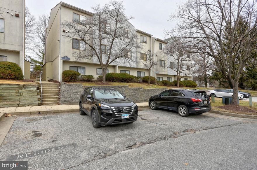 Welcome to this stunning condo where style meets comfort. Highlights include a charming wood-burning fireplace, dramatic cathedral ceilings, and skylights that create a bright, airy atmosphere throughout. The home boasts a modernized kitchen and in-unit washer and dryer for effortless living. Ideally situated just minutes from Towson, major highways, and the city, this home offers both convenience and serenity. Recent community-wide landscaping and exterior upgrades make this property truly move-in ready.