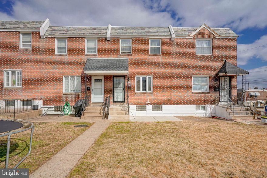Welcome to this beautifully updated brick-front row home with front patio, ideally situated on a quiet block in Northeast Philadelphia. From the moment you enter, you’ll appreciate the modern finishes, including luxury vinyl plank hardwood flooring, recessed lighting, and fresh paint throughout.

The main level offers a spacious living room highlighted by a bright bow window with custom electric blinds, flowing seamlessly into an open-concept dining and kitchen area—perfect for both everyday living and entertaining. The dining space features a ceiling fan and overlooks a stunning gourmet kitchen complete with gray shaker cabinetry accented by sleek black hardware, elegant quartz countertops with glass tile backsplash, porcelain tile flooring, and a full suite of stainless steel appliances including a gas range, built-in microwave, dishwasher, and refrigerator.

Upstairs, unwind in the spa-inspired bathroom showcasing a beautifully tiled surround, expansive stall shower with bench seating, relaxing soaking tub, and stylish new vanity and lighting. The remainder of the upper level features three generously sized bedrooms, each offering ample closet space.

The lower level provides a full basement with a separate laundry room, including washer and dryer, and convenient access to the one-car garage and private driveway for off-street parking.

Enjoy peace of mind knowing that nearly every major mechanical has been replaced within the past year, including central air, heating system, windows, and water heater.

This move-in-ready home combines modern upgrades, functional living space, and a prime quiet-block location—schedule your showing today.