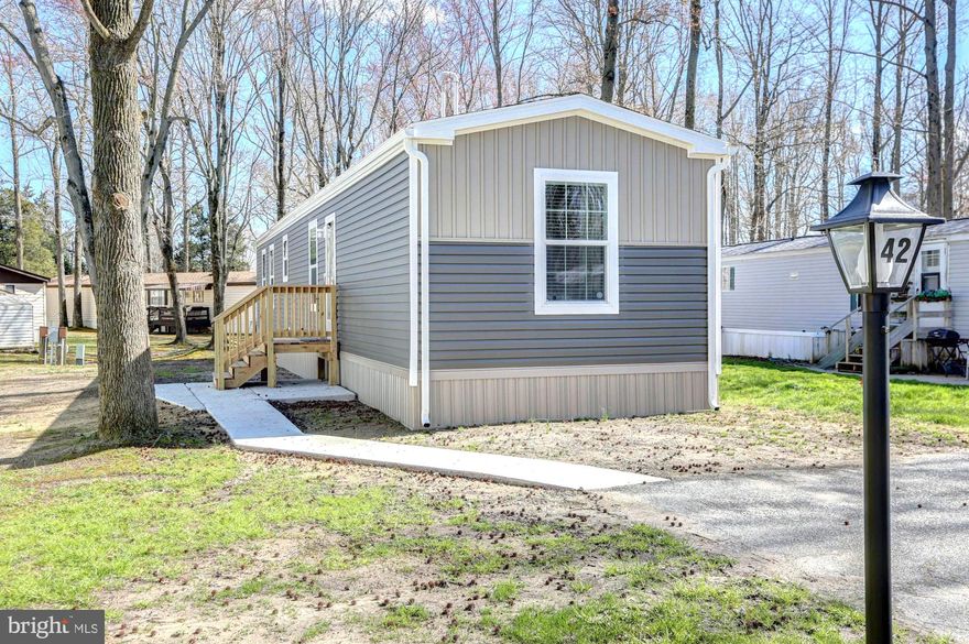 Welcome to this newly built, beautifully designed single-level home that seamlessly blends modern finishes with timeless comfort. Step inside to a bright, open-concept living space that flows effortlessly into the kitchen—perfect for everyday living and entertaining. The kitchen is the centerpiece of the home, complete with recessed lighting, stainless steel appliances, ample counter space, and room for an eat-in dining table. This move-in-ready property features 2 spacious bedrooms and 2 full bathrooms, recessed lighting, LVP flooring and custom shelving throughout.  Additional highlights include brand new HVAC, roof, and siding in 2025, convenient main-floor laundry, and a 2 car driveway.  This new home is located just minutes from Route 13/Route 1 and offers easy access to shopping, dining, schools, and fitness centers, while still providing a peaceful, private setting.  Don’t miss this opportunity—schedule your private showing today!