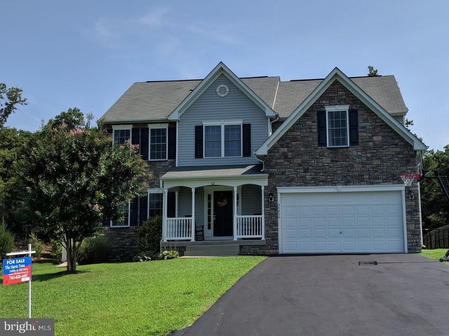 Beautiful and well maintained 4 bedroom 2.5 bath 3 level home w/walkout basement. Over 2,500 sf on top 2 lvls. Lovely open kitchen has middle island and breakfast area. Freshly painted. Deck off breakfast area opens to large fenced yard that backs to park land. Master bath has been updated with marble tile. Basement is already framed out for rec room, bath, bedroom & storage rm. Nicely landscaped.