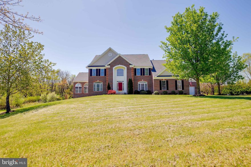 Want to be in the heart of everything that western Prince William County has to offer and yet have your privacy too? If so, then this is the perfect home for you! This move-in ready home is conveniently located near the shops, restaurants and entertainment areas of Haymarket and Gainesville, and is also close to major commuter routes and transportation options. With over 8400 finished square feet over three levels, you'll be impressed with the spacious rooms and beautiful finishes throughout this home. When you walk in the front door, the first thing that you will notice is the stately two story foyer with curved staircase and hardwood floors.  To your left is a formal living room with hardwood floors and a double sided gas fireplace and to your right is a formal dining room with hardwood floors, chair rail, and crown molding. There is a stunning sun room off of the formal living room which shares the double sided gas fireplace and has floor to ceiling windows on three sides as well as a vaulted ceiling.   There is a main level office on the back side of this house for privacy.  There is also a large  family room with a fireplace overlooking the saltwater pool and private backyard.  This home boasts a gourmet kitchen, a spacious eating area attached to the kitchen, a large pantry  with custom shelving, and a main level laundry room with a new washer and dryer. After a long day, you will be glad to head upstairs and retreat to the spacious primary suite which has a large sitting room as well. The attached bath has double sinks, a glamorous soaking tub,  and a large separate shower. There are three other spacious bedrooms, one with an ensuite bath, and the other two with a jack and jill bath on this level as well. The enormous finished basement is made for entertaining.  It has a legal 5th bedroom, a full bath, a half bath, a huge a family room/ game room with a glamorous wet bar and pool table, an exercise room, and a theater room decked out with reclining chairs, a projector and screen, and a sound system. Outside, your oasis awaits.  There is a  large pool and built in hot tub which were recently converted to salt water.  The pool equipment was replaced in 2019 and an automated smart system (Haywood Aqua Control) was installed so that you can control everything related to the pool from your phone.  There is also a new cover for the pool.  In addition to the pool there is a large deck and patio as well as an outdoor kitchen. This community allows horses so with a little work, you can turn your land into horse fields if you'd like.  In 2018, the electrics and pumps were replaced for the septic and the well tank was replaced as well.  In 2020, the upstairs HVAC was replaced.  This home currently has 3 HVAC systems.  In 2021 all 3 garage doors and openers (including LED and cameras) were replaced.  This home also has 2 Nest thermostats, a Nest doorbell,  and a Smart Things Home Automation System (Z Wave) which controls 52 smart switches in the house.  The seller plans to leave the trampoline (if wanted), wine fridge, bar fridge, kegerator, commercial grade whole house wifi internet system, pool table, theater chairs, theater projector, theater sound system, basement bar stools, kitchen island stools, garage cabinets, as well as the 2 Nest thermostats, Nest doorbell, and Smart Things Home Automation System (Z Wave).  When you want to leave this amazing home, you'll find that you're close to everything! You're located conveniently close to the shops, restaurants, and amenities of Haymarket and Gainesville. For commuting you have easy access to Rt 66, Rt 15, and local commuter and park and ride lots. This home is zoned for much sought after Battlefield High School. If you're ready for an amazing move-in ready home in a fantastic location, wait no longer because you've found what you're looking for! **Sellers will need a 60 day rent-back after closing.**.