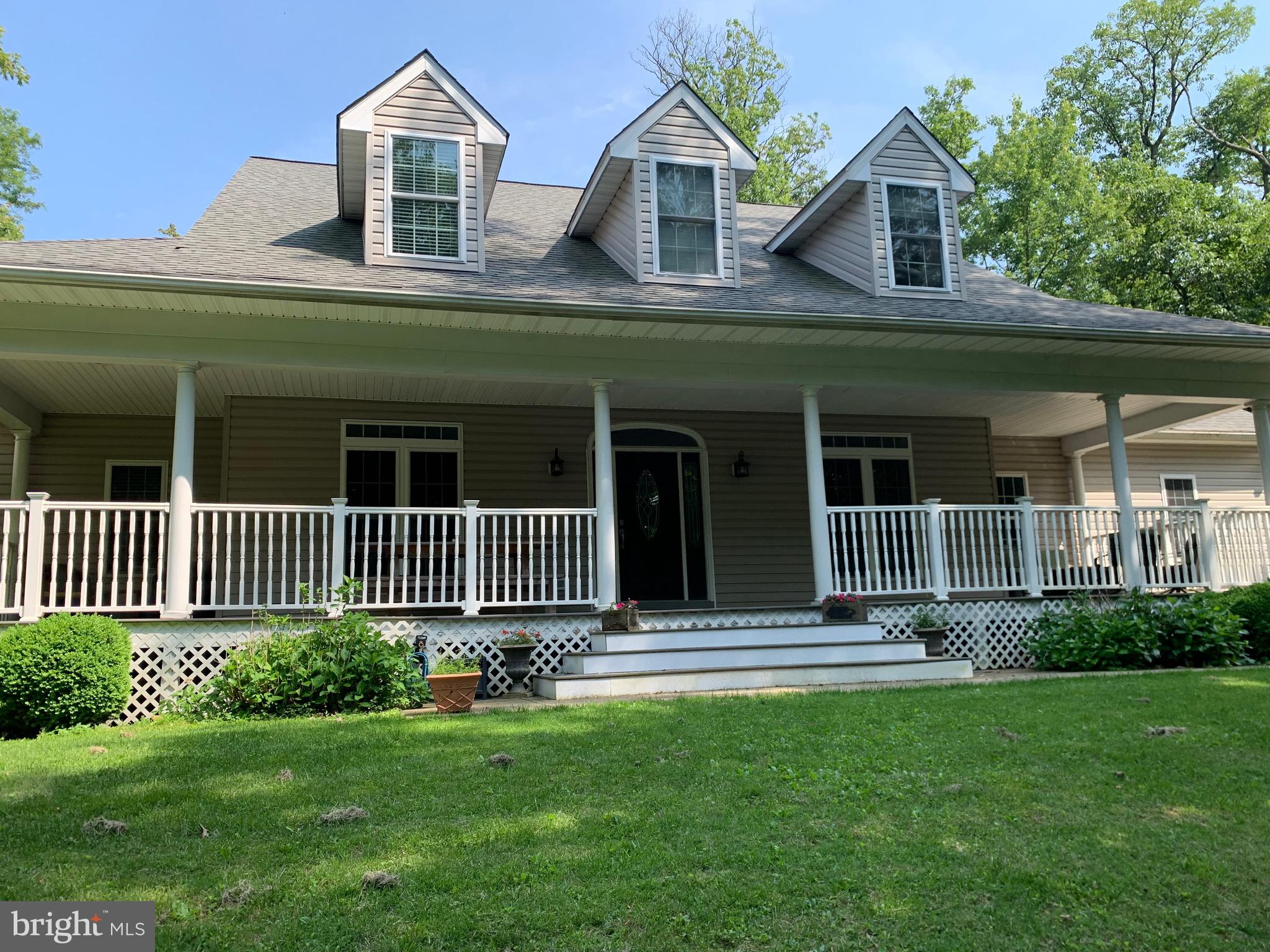 Stunning home with surprisingly large custom floor plan, like no other cape that you've seen before. Featuring a large wrap around front porch w/tons of seating areas and trex type decking. Inside you will find soaring ceilings, spacious rooms w/ crown molding, grand open 2 story staircase, columns from foyer to formal dining room, glass French doors to the library, 2 story family rm w/wood burning fp, unique tavern grade wood flrs, lrg kitchen w/ lots of cabinets and counter space (Corian), large curved snack bar and open to the breakfast area & family room. The lrg main level laundry is also off the kit, which is equipped w/full size washer & dryer, cabinets w/ a wet sink. Also, there's one of two main level half baths, access to the oversized 3 car garage and door to the year yard. On the other side of the home is the 2nd half bath and the amazing primary suite w/ luxury primary bath featuring upgraded lrg jetted tub, multi head custom steam shower, two large separate sinks & vanities w/ custom built in wardrobe/linen cabinet between the two and a large walk-in closet w/ window for natural light. Go up the grand open curved staircase to the 2nd floor which features open rails overlooking the staircase and the 2 story family room. There's 3 BR upstairs each w/their own full bath, plus a lrg bonus rm over the garage used as guest rm/bunk rm. In the lower level you will discover an enormous rec room/game room with enough space for all your entertaining needs w/ atrium doors leading to the dbl wide exterior walk-up stairs. LL offers a sink/wet bar, lrg island/snack bar for stools w/ cabinets & drawers, a full bath, a Speak Easy (secret room enter through the Murphy Door/bookcase) w/ custom epoxy resin floor & stamped tin/copper ceiling, two small storage areas & two large unfinished storage rooms/utility rooms w/ built in shelving. The backyard is set up for incredible outside entertaining, featuring a sidewalk and gate from the driveway, a big open patio on each side of the lrg custom covered patio with vaulted ceiling, beams & dual ceiling fans, a fenced-in rear yard and a shed. Seller installed new architectural roof in 4/2020 & new "Leaf Filter" gutter protection system 9/2024. Seller uses Starlink dish for internet, there's a whole house generator, central vacuum, Spacepak for efficiency & high velocity AC, All floors are heated by radiant heat w/ individual thermostats, Triangular Tube Smart hot water heater which heats more hot water with less fuel and there's also Instant hot water. The property is located in a rural setting just a few miles to the charming town of Boonsboro. Conveniently located between Frederick & Hagerstown just over the county line into Washington County. One side of the yard sides Rt 40, the rear yard backs to I70. Property is extremely close to The Appalachian Trail and Greenbriar State Park which offer a lake for swimming and kayaking, a beach, camping & hiking/walking trails. Both Frederick & Hagerstown offer a wide variety of shopping, dining, entertainment, parks & museums. Each city has a hospital, colleges and both offer numerous medical facilities & emergency medical facilities. Several nearby park & ride parking lots at many exits off I-70 for carpooling/commuting.
Total SqFt 5258, Total AbvGrdSqFt 3272, Total BelGrdSqFt 1,986, Total BelGrdFinSqFt 1490 per a appraisal from just few years back.
Note: The home could use fresh painting and touching up, owner will consider patching and painting of walls with the right offer or consider offers to an account for that update on their end.