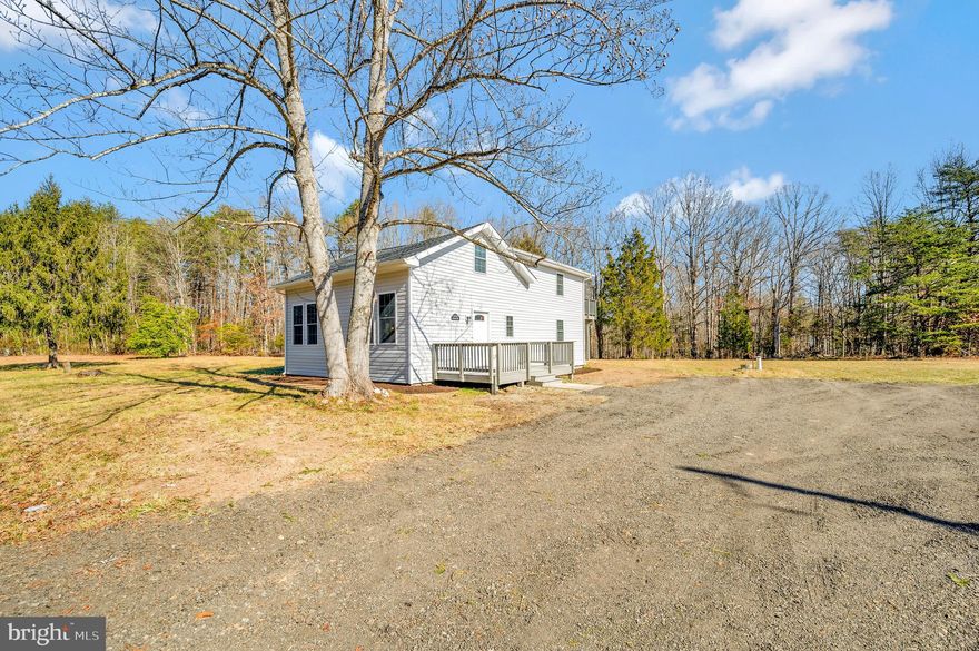 Cute as can be. 2 primary bedrooms, each with their own full bath plus a powder bath.  Newly remodeled home.  Perfect spot upstairs for a sitting area/office.  Upper level primary bedroom has a private deck. Great location with no HOA. Luxury vinyl flooring, recessed lights, stainless steel appliances, granite countertops, white cabinetry, new windows. Bedrooms have carpet. There are 2 decks AND a patio. Septic was recently pumped and inspected. New distribution box  installed. Freshly painted. New siding. Newer roof.  Home warranty. Great location, convenient to Fredericksburg, Warrenton or even Manassas.