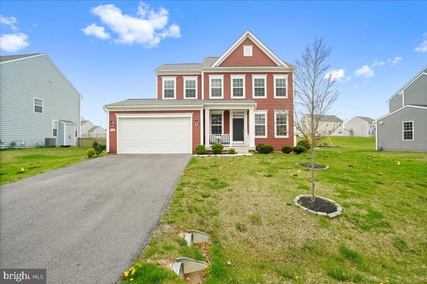 Welcome to your dream home in the highly sought-after Westfields community! This nearly brand-new contemporary Colonial, completed in 2021, offers the perfect blend of modern elegance and comfortable living. As you approach the home, you'll be greeted by a charming covered porch and a convenient two-car attached garage. Enter into the light and airy contemporary floor plan, where generous windows pour with natural light into your beautiful open-concept living areas. With 4 bedrooms and 3.5 baths, this home provides ample space for family or guests. The heart of the home is the gourmet kitchen with newly upgraded backsplash. Retreat to the primary suite, where you'll find an upgraded primary bathroom that offers a luxurious escape from the everyday. The fully finished, walkout basement is an added bonus, providing even more space to relax and recreate. For your peace of mind, the home is equipped with a security system. Living in the Westfields means being part of a vibrant community. With 150 acres of open space, you'll have plenty of opportunities to enjoy the great outdoors. Take advantage of the community pool, tot lot, walking paths, tennis court, basketball courts, park, and gazebo, all designed to enhance your lifestyle. Offering comfort and convenience in a desirable location, this home checks all the boxes!