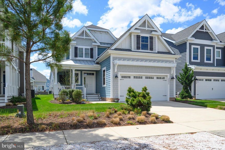 Welcome to 22072 Seaport Square, a beautifully appointed Schell Jasmine model in the sought-after Bayside community. This 4-bedroom, 3.5-bath home offers an open-concept floor plan with abundant natural light and upscale coastal finishes throughout.  The gourmet kitchen features stainless steel appliances, gas cooktop, granite countertops, glass tile backsplash, pantry, and a spacious two-tier island—ideal for entertaining. The main-level primary suite includes tray ceilings, dual walk-in closets, and a spa-like bath with tiled shower, frameless glass door, bench seating, and double vanity.  Additional highlights include a vaulted sunroom, powder room, laundry room, and a dramatic great room with soaring ceilings and a switchback staircase. Upstairs offers a versatile loft, two guest bedrooms with shared bath, and a private en-suite bedroom—perfect for guests.
Located in the amenity-rich Bayside community, just minutes to Fenwick Island, Bethany Beach, and Ocean City beaches. Ideal as a primary residence, second home, or investment opportunity.