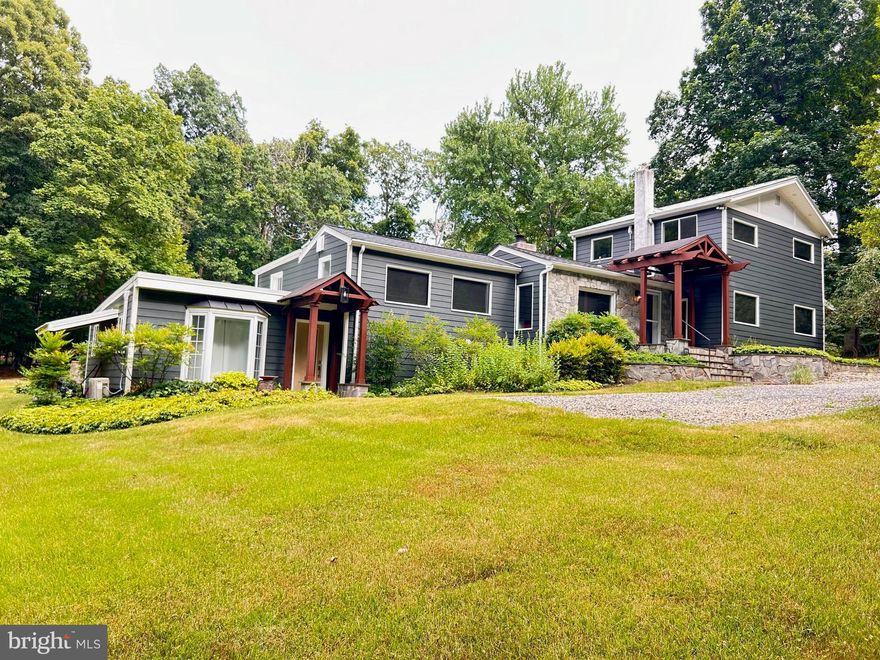 Welcome home to 3906 Oaklawn Road! Beautiful home with a touch of European styling sitting on a 1 acre lot. The charm of this home is in the design, and the peacefulness and serenity  you feel. The hardscaping that outlines this home is just perfect. Three porches and a large stone and slate patio off the back of house. Pavilion that is covered boasting over 400 sq. ft.on a concrete slab.  Built in fireplace and room for your grill and many guests. This is just perfect for entertaining. The exterior of the home is beautifully landscaped with lots of room for your needs. This home features 4 bedrooms and 3 full baths that remodeled with tile  and stone. There is a primary bedroom downstairs with its own separate entrance and bathroom. Across from there is the kitchenette this has a sink and cabinets all you need is the refrigerator and stove. Also plenty of storage space in the 2:other rooms. Washer and dryer are also downstairs. Main level has a galley kitchen  with lots of open shelves and drawers. The gas fireplace is great for those cool evenings. The office is located next to the family room with a barn door closure to give privacy. Bedroom #2 is located across from office with a exterior door that opens to a patio. Upstairs has 2 bedrooms with large closets and another beautiful bathroom. Don’t let this one get by without scheduling a showing. This is an  AS IS LISTING.