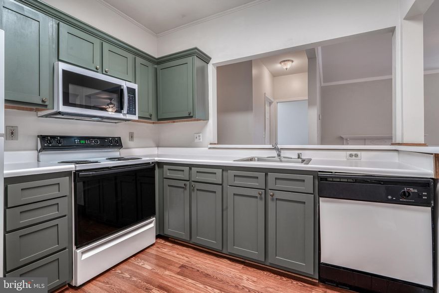 Stunning 2-bedroom, 2-bathroom condo in desirable Odenton location! This beautifully updated condo is perfect for first-time homebuyers or empty nesters alike. With its spacious layout and convenient location, you'll love calling this place home. The main living area is bright and airy, with large windows that let in plenty of natural light. The updated kitchen opens to a spacious dining area for entertaining guests. The bedrooms are both a good size, and the master bedroom has its own private bathroom with a walk-in closet. There's also a bonus room that could be used as a den, office, or playroom. The primary bedroom leads to a private deck perfect for enjoying nice weather or a morning cup of coffee.  The whole unit has brand new carpet. All windows were replaced with high quality Thompson Creek windows with a transferable lifetime warranty.  The condo complex is well-maintained with Tot-Lot, Dog-Park, and Picnic/Grill Area. It's also located close to shopping, restaurants, and schools. This condo is move-in ready and won't last long! Schedule a showing today to see it for yourself.