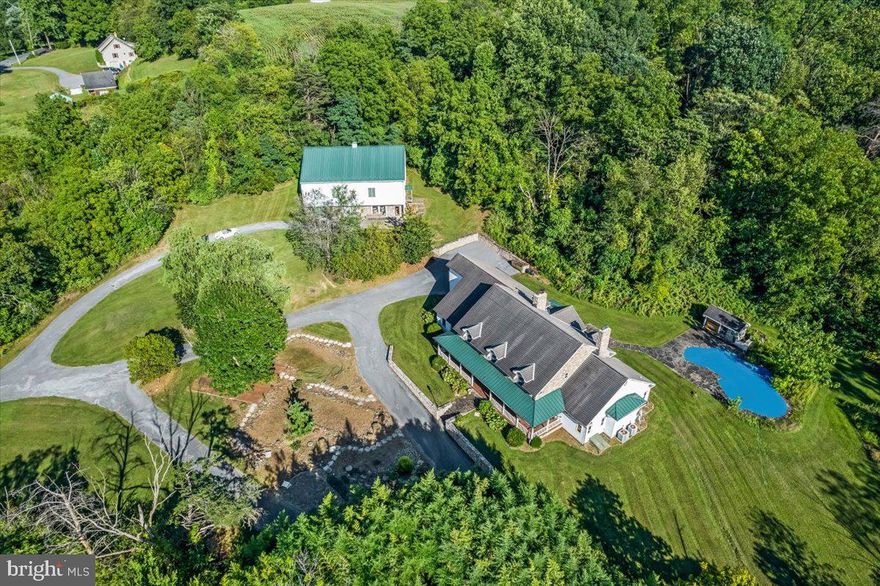 Unique and rare opportunity for affluent Buyers.  Cash Buyers only please.   13 glorious ACRES in Central PA. BARN and HOME BUILT in  or about 2001.  44x60 bank barn style w metal roof and concrete floors features office &/or apartment or guest quarters and more plus full BASKETBALL GYMNASIUM on 2nd level (potential for volleyball, pickleball, private dance studio or wrestling training arena).  Home is over 5,000  SF above grade plus 1,000 SF  in lower level. 3 floor to ceiling stone fireplaces. Two primary suites.  Seller is relocating and unable to complete their dream renovation. Tax amounts are clean and green. Make this FOREVER YOURS today. Privacy & seclusion while enjoying convenience nearby!   The seller is relocating and unable to complete their dream renovation, leaving the dwelling a major rehab project, essentially a shell with some new floors and electrical updates.  Being so as is, no warranties expressed or implied.  "Buyer is aware that the property is sold AS IS with no warranties expressed or implied." Buyers should be informed of the substantial rehab costs, estimated at $250K–$500K beyond the purchase price, and are advised to bring contractors etc. to showings to speed up their offer plans.  PLEASE perform Buyers due diligence required before making offer-similar terms when purchasing at auction, bank represented or other AS IS properties. Only serious cash buyers with satisfactory proof of funds will be considered,  NEVER DRIVE BACK LANE - POSTED.  Cameras. Request details. GAME CHANGING opportunity.