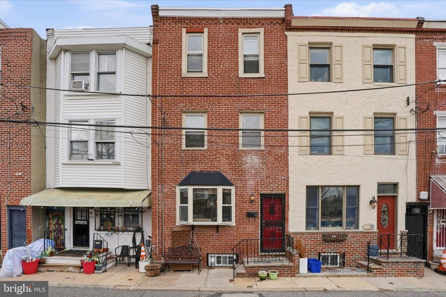 Located in the Bella Vista / Italian Market neighborhood, this charming row townhouse offers a blend of classic Philadelphia character and functional updates. This home is larger than most in the area, featuring approximately 1,440 square feet of living space across three stories that include spacious bedrooms and a large upstairs bathroom. 

The first floor includes hardwood flooring and an open living and dining area, leading to an eat-in kitchen equipped with stainless steel appliances. The layout provides a practical flow for everyday living and dining. Ceiling fans and central air conditioning contribute to year-round comfort, along with forced hot air heating. The property includes three large bedrooms and a full ceramic tile bathroom. Additional features include newer windows and updated electrical systems. The unfinished basement offers additional space for storage or potential customization. Situated in a well-established neighborhood, the home is located near a variety of local restaurants, shops, and everyday amenities along the Italian Market corridor. A city parking lot directly across the street provides convenient access to parking in an area where it is often limited. This property presents an opportunity for both owner-occupants and investors seeking a home with solid fundamentals in a central South Philadelphia location.