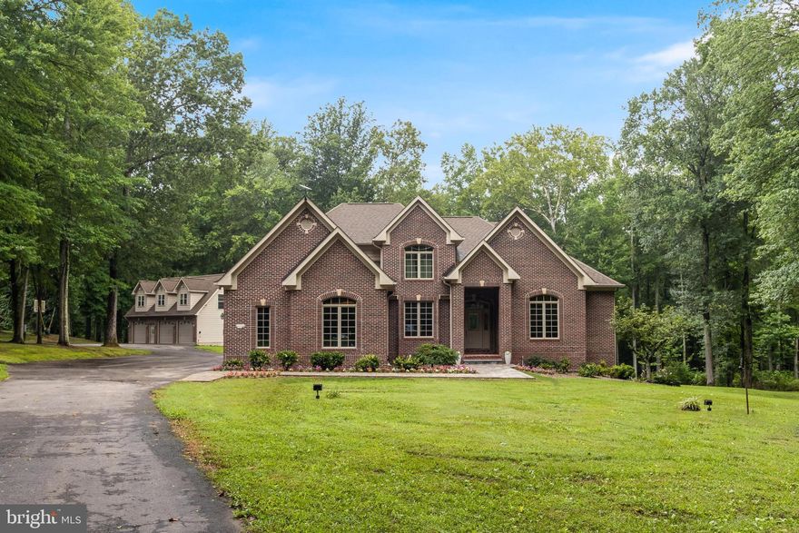 An extraordinary private estate offering the perfect blend of refined living, outdoor recreation, and peaceful seclusion in the heart of Southern Maryland. Set across beautifully landscaped grounds with winding creeks, charming arched footbridges, and expansive open space, this property presents a rare opportunity for those seeking both luxury and a connection to nature... Thoughtfully designed and custom-built on over 20 acres — complemented by an additional buildable 4-acre parcel — the residence showcases five generously sized bedrooms, three full bathrooms, and two half bathrooms. Warm natural light fills the home, highlighting gracious living spaces, a striking two-story great room, and a flowing floor plan that seamlessly balances everyday comfort with elegant entertaining. Multiple gathering areas, inviting architectural details, and timeless finishes create a home that is both sophisticated and welcoming... Outdoors, a true backyard retreat awaits. A sparkling in-ground pool and relaxing hot tub are surrounded by lush landscaping and tranquil views, creating an idyllic setting for quiet evenings, lively gatherings, and effortless outdoor living.... The property’s versatility is enhanced by a detached garage with approximately 1,000 square feet of finished living space above. This private area offers exceptional flexibility as guest accommodations, multi-generational living, or a potential income-producing opportunity with both short- and long-term rental possibilities... With abundant open land ideal for ATV riding, gardening, recreation, or simply enjoying the serenity of the countryside, this remarkable estate offers a rare combination of space, privacy, and lifestyle appeal... A truly special offering where comfort, nature, and opportunity converge.