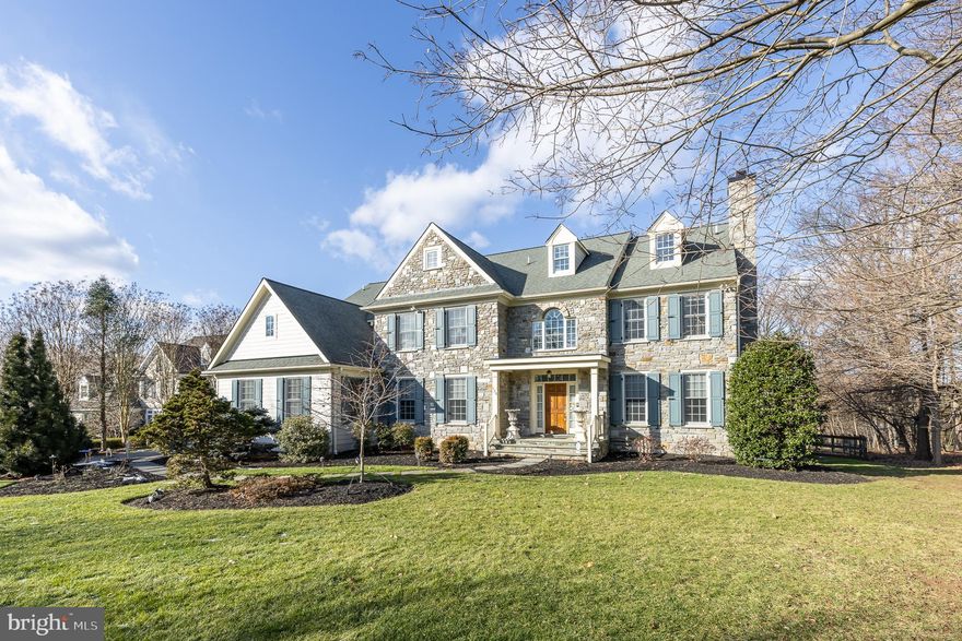 Move right into this fabulous stone and siding traditional home on a private cul-de-sac in the heart of Northside Villanova, Lower Merion Township. A dramatic 2 story entrance Foyer with a motorized chandelier welcomes you inside. The Living Room features a gas fireplace with marble surround. French doors lead into a Library with built-in shelves; perfect for working from home. The gracious Dining Room with wainscoting is wonderful for large gatherings. A Butlers Pantry complete with a wet bar and wine refrigerator lead into the expansive Chef’s Kitchen with spacious center island, granite countertops, Sub-Zero refrigerator, large 48 inch gas Viking range top, Dacor 30 inch double ovens, warming drawer, Bosch dishwasher, walk-in pantry, separate Breakfast Room with sliders to a spacious deck; perfect for dining and entertaining outdoors. The Kitchen is open to a dramatic 2 story Family Room with gas fireplace. Two Powder Rooms and a fantastic Laundry Room and Mudroom leading to a 3-car attached garage with epoxy floor complete the first level. Adjourn upstairs to a luxurious Primary Bedroom suite with Sitting Room, oversized walk-in closets, and sumptuous Bath with whirlpool tub, oversized shower, and separate vanity sinks. The second Bedroom is en-suite with a full Bath. The third and fourth Bedrooms, each with ample closet space, share a Jack & Jill full Bath with tub/shower and double sink vanity. The walk-up third floor is perfect for extra storage or the possibility of more living space. The extensive walk-out lower level is spectacular with storage galore and a huge recreation area which includes a large commercially refrigerated wine cellar and a bar with Sub Zero refrigerator, ice maker, sink and dishwasher.  On this level there is also a full Bathroom and another room which could be used as a fifth Bedroom. With its many windows, sunshine abounds throughout this freshly painted home. The beauty continues outside as this home is set on a little more than an acre of flat ground with a fenced-in yard and lovely landscaping. Situated in a prime northside Villanova central location, this home has it all!