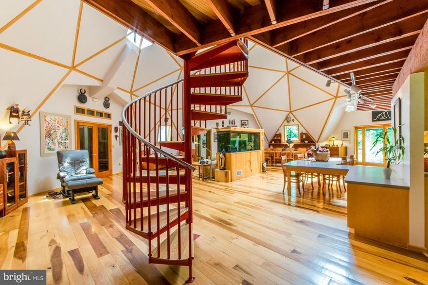 Once in a lifetime opportunity to own a unique contemporary dome design home on 8.247 secluded acres, unrestricted, with 40x60 workshop, with elec. and water and 15' garage door. Home has wide plank hdwd throughout, 2 MBR suites, open floor plan with lofts throughout. 4th BR has murphy bed and complete office set up. Imagine! Live, work and play from home. Inground pool. Great commuting area!