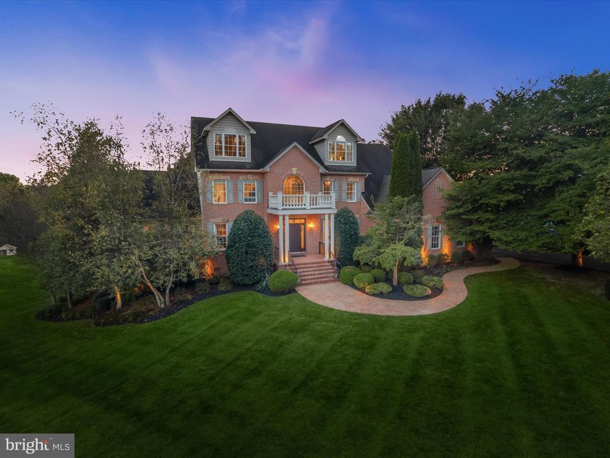 An exquisite brick residence set in one of Western Howard County's most sought-after communities, Cattail Creek, this home presents nearly 6,000 square feet of refined living space across four finished levels. Perfectly positioned across from the prestigious Cattail Creek Country Club, it combines timeless architecture, a premier golf course setting, and sophisticated updates throughout. Among its many standout features are 6 spacious bedrooms, 5.5 bathrooms, a gourmet kitchen, a breathtaking primary suite, and an incredible two-story outdoor living area. The luxurious outdoor spaces include a screened porch on the main level, a covered patio off the lower level, additional stone patios, water feature, fireplaces on both levels, and beautifully designed landscaping with exterior lighting, perfect for relaxing or entertaining in style. A tree-lined driveway and winding walkway framed by mature landscaping lead to the welcoming front portico. The three-story foyer makes a striking first impression with it's incredible architecture design, flanked by a private office and a formal living room. Crown molding adds polish here and in the dining room, which also features wainscoting. French doors in both rooms open to a bright and airy conservatory crowned with a cathedral ceiling, creating a sun-filled retreat. From the dining room, the home flows into the gourmet kitchen, a chef’s dream anchored by high-end white cabinetry with under-cabinet lighting, an island with contrasting black cabinetry, and Quartzite natural stone counters. Professional-grade appliances include a six-burner Viking range, a second wall oven, and a built-in microwave both in the island. The panel-ready Subzero refrigerator blends seamlessly with the cabinetry for a cohesive look. An apron-front sink, wet bar with beverage coolers, and casual eat-in dining area further elevate the space. Just beyond, the family room showcases a stone fireplace flanked by tall windows topped with Palladian and transoms, while French doors lead to a remarkable screened porch, complete with a wood-planked ceiling and outdoor fireplace. To complete the main level, a spacious laundry and mudroom with custom built-ins off of the garage add convenience. The first upper level begins with the exceptional primary suite, where a tray ceiling and wet bar with beverage fridge set the tone for everyday luxury. A generous dressing room with bespoke closet storage, two additional walk-in closets, and a spa-like bathroom complete the retreat. Here, separate vanities, a freestanding soaking tub, and a shower with variegated aqua tile and frameless glass create a serene experience. Two additional bedrooms, each with a renovated en-suite bath, complete this level. The top floor offers two additional bedrooms and a full bathroom with frameless tiled shower. The expansive lower level provides space for entertainment and leisure, featuring a recreation room with wet bar and beverage refrigerators, a theater room with projector and screen, a sixth bedroom or additional office space, full bath, and a bonus space ideal as a home gym. Outdoor living off the lower level is just as impressive. A custom stone patio includes a covered section with a dual-sided fireplace and exterior lighting, all overlooking the fenced backyard and a property that extends well beyond. With an oversized side-loading three-car garage and too many improvements and newer systems throughout to list, this home balances elegance with peace of mind. This one is truly a turn key home.  Adding to its appeal, the property enjoys no HomeOwners Association and sits directly across from Cattail Creek Country Club. Membership is optional yet appealing, with award-winning golf, tennis, pickleball, pool, and a renovated clubhouse with dining and social amenities. With its blend of luxury finishes, thoughtful design, and an enviable setting, this home presents an extraordinary opportunity for refined living and effortless entertaining.