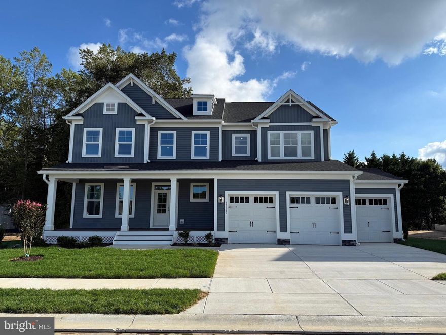 Welcome to the Newport model by Foxlane Homes, located in the boutique community of Suncrest in Lewes, Delaware. With over 4,700 square feet, 5 bedrooms, 4.5 bathrooms, and a 3-car garage, this home delivers space, flexibility, and thoughtful design from top to bottom.

As you step inside, you're greeted by a dramatic two-story foyer that flows directly into a light-filled great room with soaring cathedral ceilings. The natural light here is incredible. Just off the main living area, the expansive deck overlooks a private, tree-lined backyard — giving you that peaceful, tucked-away feel while still being minutes from everything.

The kitchen is exactly what today’s buyers are looking for: beautiful two-toned cabinetry, soft white quartz countertops, premium finishes, and durable LVP flooring throughout the main living spaces. It’s clean, elevated, and built for everyday living as well as entertaining.

The first-floor primary suite truly feels like a retreat, featuring a cathedral ceiling, box bay window, and a spa-inspired bath designed to help you unwind at the end of the day.

Upstairs, you’ll find three additional bedrooms, two full baths, and a bonus room that can flex however you need — home office, media room, guest retreat, you name it.

The fully finished basement expands your possibilities even further. Whether it’s game nights, fitness space, entertaining guests, or multigenerational living — this home gives you options.

And then there’s Suncrest — a boutique 36 homesite community designed for those who want a quieter, more intimate setting. Enjoy pickleball, bocce, and evenings around the firepit courtyard — all just minutes from Lewes beaches, dining, and shopping.

If you’ve been waiting for a move-in-ready home that offers both luxury and lifestyle, the opportunity is here.