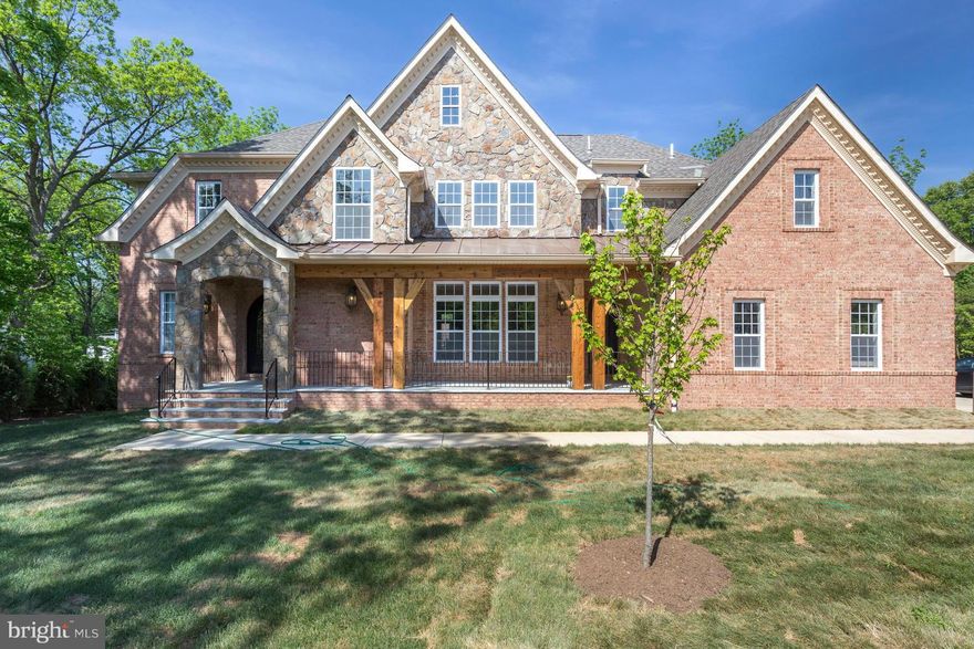 PRICE DROP! Dramatic entry hall with 2 story foyer and sweeping staircase, spacious rooms, crown moldings, and tray ceilings. Solid oak on site, hand stained wood floors on 2 levels, gourmet kitchen with top of the line SS appliances. Gorgeous lighting fixtures. Master suite with balcony. Basement with prewired media room.