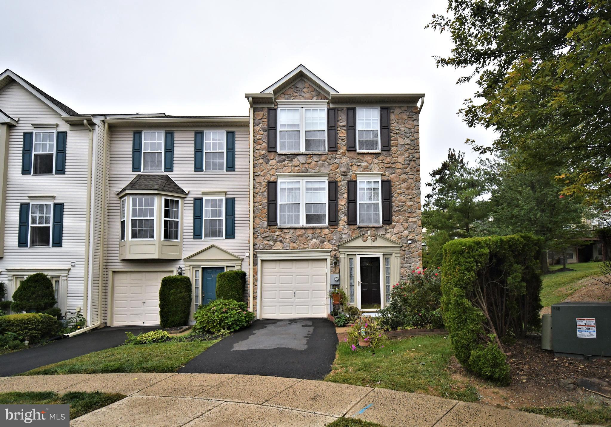 Great opportunity to own a super spacious end unit townhome in Terrace at Montgomery! Lovely and well lit with natural lighting and large rooms! Enter downstairs into the large great room that can be used as a 2nd family room/tv area/home office/gym/playroom---a really great walkout space with all the light, concrete patio, half bath, laundry closet and storage. Upstairs, main level offers huge living room with light Berber carpet, and all the room you need for a cozy sectional or couch & loveseat or some big overstuffed comfy chairs. Open to eat in kitchen with lovely hardwood and granite counters & island for more storage and seating if needed. Sunny dining area has room for a nice table and all the chairs you may need. Open to sunroom/bonus room that can be used as a formal dining room or an additional tv/game area--very flexible to your needs. Newer slider out to large, private deck with so much room for your grill and outdoor furnishings. Go on up to the 3rd level for the main bedroom suite with large walk-in closet, full bath with jacuzzi soaking tub and stall shower. 2 other bedrooms share the hall bath that has a tub/shower combination. Great neighborhood that is close and convenient to major routes--202,463,309, 476 PA Turnpike, several Septa Regional Rail Stations, Costco, Wegmans, Target, Whole Foods, Trader Joe's and so much more! Hurry out and take a look! Roof replaced 2024.