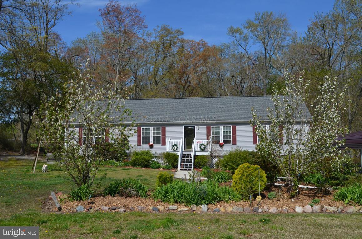NESTLED ON 12 ACRES IN THE COUNTRY, YET CLOSE TO TOWN & THE SCENIC POCOMOKE RIVER & PUBLIC BOAT RAMP, SITS THIS LOVELY 3 BR, 2 BATH RANCH. IDEAL FOR NATURE LOVERS & THOSE WHO DESIRE QUIET COUNTRY LIVING! YOU'LL LOVE THE OPEN FLR PLAN WHICH FEATURES A HUGE GREAT RM W/ LAMINATE FLOORING & FIREPLACE, LG KITCHEN WITH CORIAN COUNTERTOPS & CENTER ISLAND, DINING AREA & EVEN A WINDOW SEAT TO ENJOY WATCHING THE BIRDS, DEER & OTHER WILDLIFE. THE SPACIOUS MASTER BEDRM FEATURES A WALK IN CLOSET & BATH W/DOUBLE BOWL VANITIES, SOAKING TUB & SHOWER. YOU EVEN HAVE A SEPARATE LIVING RM FOR ADDL LIVING SPACE. THE PROPERTY BOASTS A BEAUTIFUL LANDSCAPED WALK, 2 CARPORTS AND OUTBLDGS, A LG DECK TO ENJOY THE OUTDOORS AND OF COURSE ALL THE WOODED ACERAGE TO EXPLORE! LIFE HERE IS GOOD INDEED!