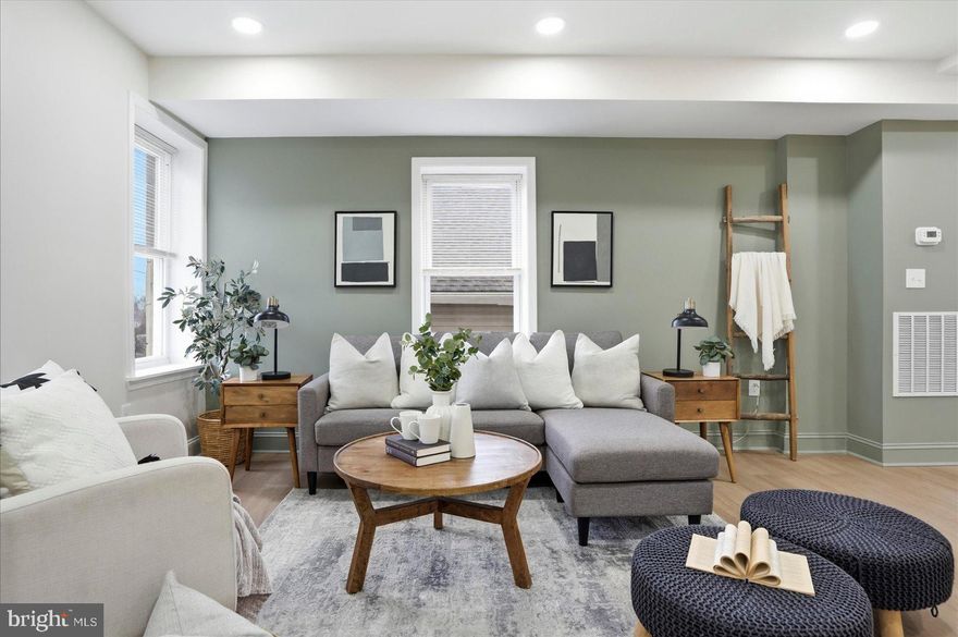 Beautifully remodeled and move-in ready, this 3BR/2BA end-of-row townhome is located a quiet neighborhood.  Make your way to the covered front porch and step into your forever home.  This home offers an open main floor plan, custom tray ceilings, a warming color palette, abundant natural light, a see-though staircase wall, and luxury flooring.  The main floor boasts a large living room and a stunning kitchen with a dining area.  The kitchen features two-tone cabinets, sleek quartz countertops with a subway tiled backsplash, stainless steel appliances, and a stainless sink set into an island with a waterfall edge, pendant lighting, and breakfast seating for three.  The second floor has three newly carpeted bedrooms: two sizable secondary bedrooms, a larger primary bedroom with a double closet, and a newly remodeled full bathroom. The lower level offers additional finished living space, including a large family room, a full bath with a walk-in shower, laundry, storage, and a walk-out to the newly fenced yard.  From the main floor step outside onto a newly constructed wood deck that overlooks a backyard and a side yard, which connects to the front yard, all with so many possibilities. This move-in-ready home is ideal for any new homeowner, and is located near shopping, restaurants, and commuter routes.