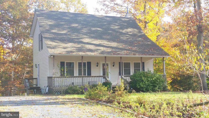 This custom Cape Cod sits on a half acre corner lot on quiet wooded road.  3 bedrooms, 2 baths and loft perfect for reading room or home office.  Unfinished basement has a rough in for bath and walks out onto the lower level deck overlooking the woods.  Upper level deck off the main living area, covered front porch, shed for extra storage and plenty of parking in the circular driveway.