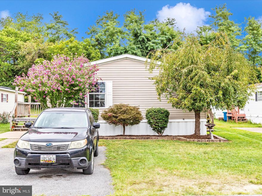 MOVE RIGHT IN!  Everything is done and READY FOR YOU!  Welcome home!  Fantastic location, backs up to the woods, which means no shared backyard!  FOUR ample sized bedrooms, two FULL BATHS, (primary bedroom includes walk in closet, private bath, double sink, tub and shower), updated kitchen, new cabinets and countertop, SS appliances - including a dishwasher!, mud / laundry room with newer washer and dryer (2021).  LVP throughout, new lighting throughout.  New HVAC 2022, new water heater 2024, nearly brand new shed.  Monthly fee covers lot, trash and recycling, snow plus:  Community Center!  Outdoor pool!  Fitness center!

*no sign on the property