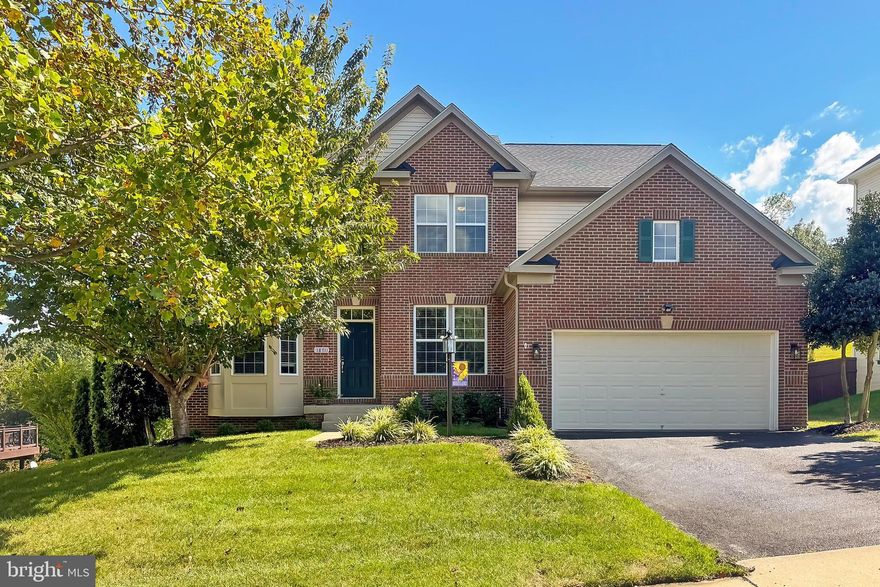 Gorgeous + IMMACULATE home with meticulous owners.  6+ bedrooms, 3.5 baths, HUGE Family room flows into  quality kitchen - stainless appliances, pretty counters, pantry Plus a large island!! NO wasted space in this spacious home. Inviting entry !  Main floor - all scraped Hardwood flooring! 1st floor study or bedroom is a huge plus! Lower level has a wonderful L shaped recreation room with  - bar or 2nd mini kitchen, Exercise or movie room, fully Bath plus another perfect Bedroom (not a legal bedroom w/small window)**  The outside has everything you desire - a sweet Trex Deck - overlooking  the 1/2 acre deep wooded lot PLUS in winter there is a water view!!  Lower level stamped concrete patio - has a HOT TUB which conveys!  Yard Sprinkler system **