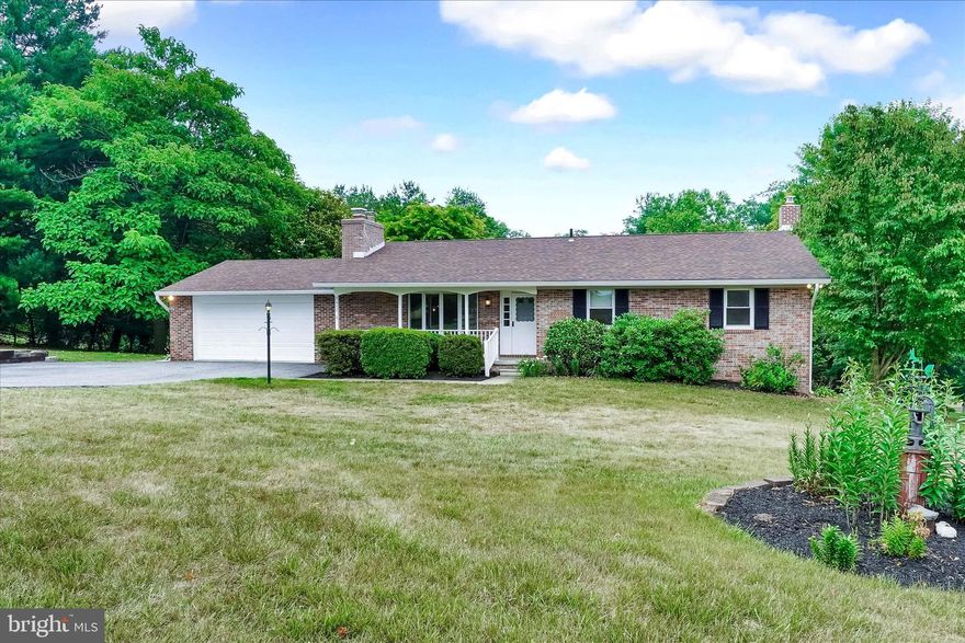 Turnkey rancher lovingly maintained by original owner with a totally refreshed interior. This home is 100% ready for you to move in and start enjoying the country life! Freshly painted inside and out, updated designer lighting, hardwood floors, beautiful brick fireplace in the living room, new vanities and flooring in main floor baths, and nearly new stainless-steel kitchen appliances. Updated mechanicals, windows, and roofing. Fully owned solar panels on the rear roof for energy savings. The house has great flow and generous space, but there's also a lot of terrific outdoor space. A screened porch off the kitchen is the perfect spot for meals or just hanging out, and provides access to the large deck or patio. The lower level family room is great for enjoying time together or entertaining, and an Atrium door provides walk-out access to the patio and rear yard. There's also a chimney for a wood or pellet stove. In addition, the lower level offers a fourth bedroom or office space, a large laundry room, and utility area. The oversized garage with overhead door and auto-opener gives easy access to the main floor and rear yard. And the lot is beautiful! Abundant berry bushes (feel free to taste!), vegetable garden space, specimen trees and shrubs, perennials, and large shade trees. A meditation garden features a small fish pond and a perfect spot to sit and relax. Conveniently located with easy access to Prettyboy Watershed and I-83 for commuting north or south. Enjoy all that the North County has to offer including breweries, wineries, restaurants, hiking, biking, hunting, fishing, and, of course, the highly sought-after Hereford Zone schools! Don't miss the chance to make this great house your new home!