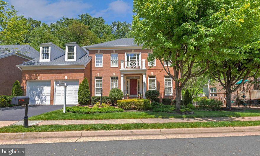 This elegant Federal style Ashmont three-sided brick Colonial offers 6 bedrooms and 5 full bathrooms, combining timeless design with modern comforts—perfect for your forever home. Situated on a premier lot, this property features a spacious yard and is ideally located across from the community pool and adjacent to the tot lot.  Inside, the two-story family room boasts soaring ceilings, crown molding, and stunning wooded views through large, sun-filled windows.  The gourmet kitchen is a chef’s dream, featuring upgraded granite countertops, abundant cabinetry, large pantry, table space, and additional seating at the island.  A formal dining room, complete with an adjoining butler’s pantry, provides the perfect setting for entertaining. Gleaming hardwood floors span much of the main level, adding warmth and character throughout.  The main level has a generous private office with a window and closet, offering flexibility to be used as a main-level bedroom with a full bathroom ensuite and Murphy bed (bedroom 6). 
Upstairs, the primary suite features a tray ceiling and spacious layout.  All bedrooms are generously sized, with plantation shutters on the front-facing rooms, echoing the home's sophisticated style.
The finished lower level includes a large recreation space with a cozy second fireplace, a private fifth bedroom, a full bathroom—ideal for guests or multigenerational living, an extra room that can be turned back into a media room, and a large storage room containing the washer and dryer.   This well built and maintained home is turn key and conveniently located.   OPEN HOUSE Sunday, 5/4  2p -4p