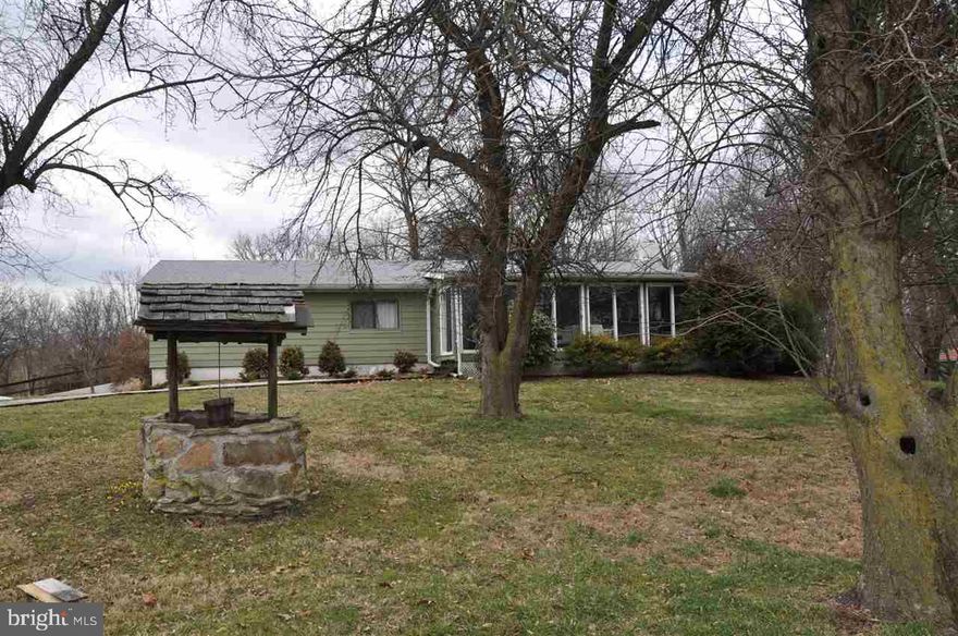 Enjoy watching nature from your living room or sun room. Peaceful views from every corner. Well kept home with 4BR, 2.5 bath, finished basement, and 2-car built-n and 4-car detached garages. Other vacant lots surround home and are available to buyer with purchase of home.