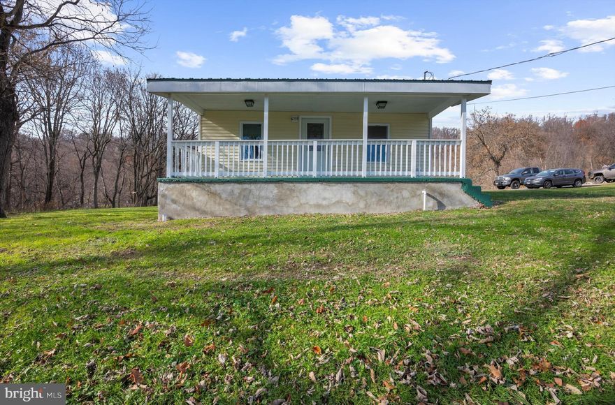 Experience the ease of one-level living and the charm of country life in this beautifully refreshed 2-bedroom, 1-bath home. Step into the bright and airy living room, where luxury vinyl plank flooring sets a warm, inviting tone. Both bedrooms feature brand-new plush carpet, adding comfort to every step.

The spacious basement offers excellent storage options or the perfect space for a workshop. Outside, a massive garage with multiple rooms provides endless possibilities for the handyman, car enthusiast, or hobbyist. With ample parking and expansive outdoor space, the property offers room to spread out and enjoy the peaceful surroundings.

Fresh paint and updated flooring throughout make this home truly move-in ready. After a long day, relax on the welcoming front porch and take in the tranquil country setting.

This home perfectly combines comfort, functionality, and the simplicity of single-level living in a serene rural setting.

* Driveway to be paved- pending weather*