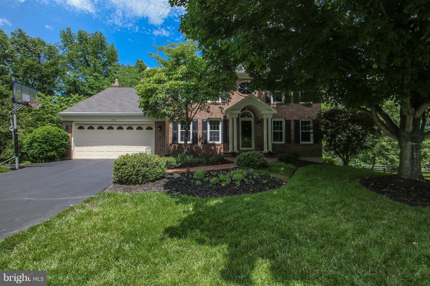 HUGE price reduction on this NV Chapel Hill model with gorgeous 27x14 screened porch w/tigerwood flooring and wooded backyard for privacy. 2 story foyer with oak stairs, MBR w/cathedral ceiling, remodeled bath and walk-in closet, large KIT open to family room w/cathedral ceiling & 2 story brick fplc w/gas insert. Walkout bsmt with rec room, full bath, workshop. Over 3100 fin sq ft. BRAND NEW ROOF