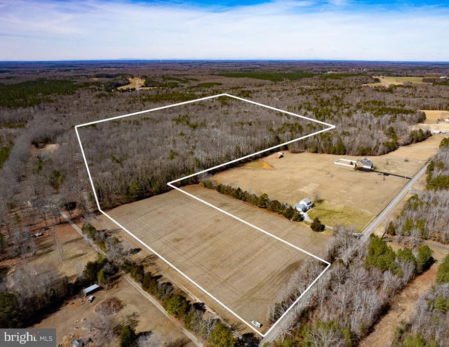 49.26 acres in Caroline County, ideally suited for residential, agricultural, or investment use, located just 10 minutes from the Ruther Glen exit on I-95. Approximately 5 acres are currently in agricultural rotation, with the balance consisting of mixed timber (white oak, red oak, poplar, pine) that is at least 41 years old based on historical aerial imagery. A culvert has already been installed to access the property from Jericho Road and with 425 feet of road frontage, multiple options for driveway access or potential subdivision are possible (buyer to verify with Caroline County & depending on soil tests). The land is relatively flat along Jericho road and elevates as you approach the wood line. The open field would be an ideal homesite, set far enough off the road to avoid jeopardizing a large backyard. The open acreage can be utilized for pasture, food plots, a garden, or to generate agricultural income. The large wooded portion in the back has established walking trails, two creeks (one appears to be seasonal) that provide wildlife habitat or income from a timber harvest. A tributary of Hawkins Creek runs through the northwest corner before meandering off the property. Build in the front and keep the woods for riding horses/UTVs, hunting, or to enjoy nature. Conveniently located 30 miles from Fredericksburg and 37 miles from Richmond, the property provides rural living with easy access to amenities, employment centers, and I-95. Have a boat? Lake Anna is just 20 miles to the west, offering plenty of opportunities for water sports on the 13,000-acre reservoir - one of the largest freshwater reservoirs in Virginia. Lake Anna State Park has 15-miles of hiking trails, picnic areas, playgrounds, & a swimming area for you to enjoy. Whether you’re looking to build a custom home, invest in land, or create a family compound, this property has options! The survey is uploaded to the MLS & no soil work has been done by the seller. Please park in the designated parking area & call the listing agent before showing!