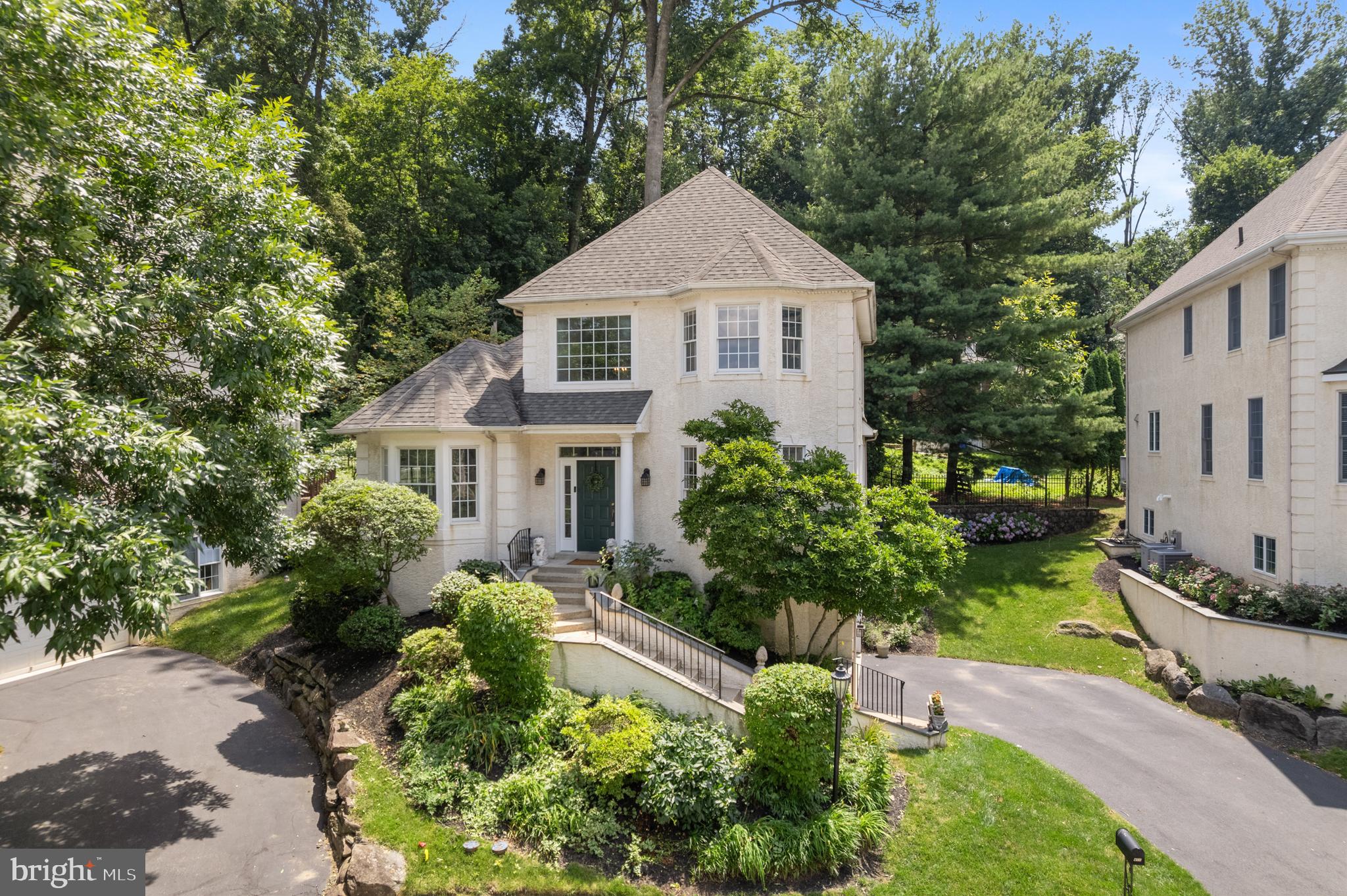 Welcome to 411 Merion Hill—a stunning, move-in-ready 4 Bedroom, 3.5 Bath home that checks every box for modern comfort, upscale design, and carefree living in one of Conshohocken’s most desirable neighborhoods. Step inside this fully updated residence and immediately feel the warmth of sun-drenched natural light flowing through the open-concept main level. Designed with entertainers in mind, the heart of the home features a chef’s kitchen with an oversized island, quartz countertops, a marble tile backsplash, stainless steel appliances, and clean, modern lines. The main and upper levels showcase engineered hardwood flooring throughout, offering both beauty and durability. Also on the main floor, retreat to the spacious primary suite, where luxury abounds. Enjoy dual vanities, a spa-like soaking tub, frameless stand-up shower, and your own in-suite laundry for everyday ease. The suite boasts his and hers walk-in closets, both outfitted for functionality and ample storage with custom built-in organizers—a feature that extends throughout the home, with closet organizers in every closet. The updated hall bathroom on this level includes a skylight, bringing in even more natural light, along with two additional spacious bedrooms. Outside, the private back deck offers the perfect setting for morning coffee, evening relaxation, or tending to a small garden. A two-car garage adds convenience, while the well-managed HOA handles all landscaping, snow removal for driveway and front steps —giving you the freedom to truly enjoy low-maintenance, high-comfort living. Downstairs, the finished lower level, an additional 974 sqft, is both flexible and stylish—providing plenty of space for guests, a home gym, or work-from-home needs. It features luxury vinyl flooring, a private bedroom, walk-in closet, updated full bath with tub, a cozy bonus den, and direct access to the attached two-car garage completes this level. Located just minutes from the Main Line, King of Prussia, Plymouth Meeting, Center City, and all that vibrant Conshohocken has to offer—from dining and shops to trails and transit -located near major highways (I-76, I-476, and the PA Turnpike), SEPTA regional rail. Make your appointment today, easy to show —this is the one you’ve been waiting for.