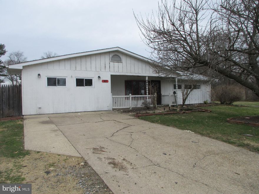 Enter through the covered front porch. The kitchen and living room and half bath are in the center of the home. Down the hall on the right find 3 bedrooms and the full bathroom. Back through the kitchen are two additional bedrooms. The back yard is fenced in. This property is eligible under the Freddie Mac First Look initiative until 4/18/2026.