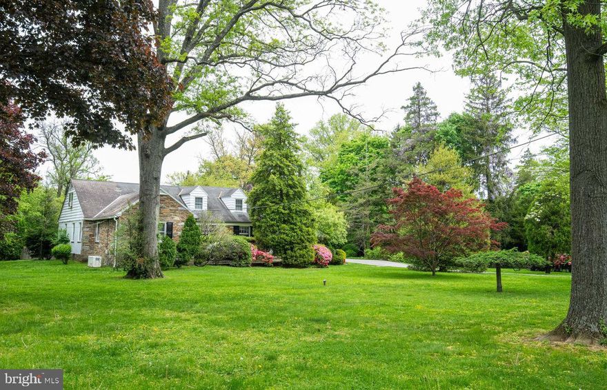 Charming and spacious 5 bedroom 4 1/2 bathrooms on desirable  quiet street in Haverford, Delaware County.  Enter from the beautiful flag stone terrace to either the center hallway or sunroom/mudroom.  Formal dining room next to an eat-in kitchen both overlook the large backyard.  The living room faces the front with a beautiful fireplace.  Home has large windows and hardwood floors throughout the majority of the house.  Primary bedroom and two additional large bedrooms are conveniently located on the first floor with two full bathrooms. The second floor has two large bedrooms with a full bath.  Finished basement with family room, full bath and laundry room/workshop.  Attached 2 car garage enters the mudroom/sunroom.   Additional features include a separate home office/guest suite with a private entrance and half bath and a fenced-in swimming pool in the private and serene setting,   This home is minutes from Haverford College, private schools, The High Speed Line and the R5 Septa Line,  Suburban Square, Main Line Restaurants.  20 minutes to downtown Philadelphia