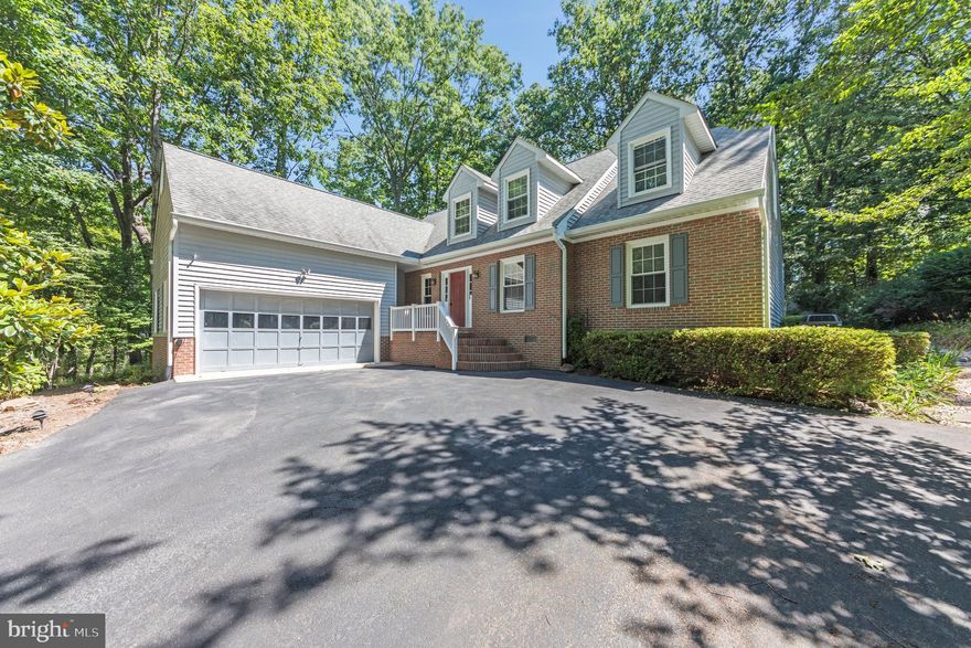 ***VETERAN ASSUMABLE 4.95% VA LOAN, $500K Balance***Nestled on a serene half-acre knoll, this charming Cape Cod home backs to tranquil woods, offering both privacy and scenic views. A two-car sideload garage and a welcoming brick front porch enhance the home’s curb appeal. Step inside to a bright foyer where warm hardwood floors and cool, neutral paint tones greet you.

Off the foyer, you'll find a cozy study, perfect for a home office. The spacious Formal Living Room and Dining Room each feature custom paint and ample space for entertaining. The well-appointed Kitchen boasts generous cabinet storage, sleek granite countertops, black appliances, a modern cooktop stove, wall oven, microwave, and a butcher’s block that conveys with the home. A cozy Breakfast Nook adjoins the kitchen, and the large Family Room features a striking floor-to-ceiling brick fireplace, ideal for relaxing or entertaining.

The main level also includes a spacious Primary Suite with an ensuite bathroom, offering the convenience of single-level living. Both the Primary Suite and Family Room provide direct access to the newer vinyl deck, which is complete with a pergola and two wooden swings—perfect for enjoying the peaceful surroundings.

Upstairs, you'll find three additional generously-sized bedrooms and an unfinished walk-in attic, offering endless possibilities for storage or future expansion. The backyard is a true retreat, with lush gardens, a meticulously maintained lawn, and partial fencing in the rear yard.

Additional features of the home include a 2020 water heater, a 2019 shed, a 5-year-old deck, gutter guards, a crawl space with a dehumidifier, central vacuum, and hardwood flooring throughout.

Located within an amenity-rich community, you’ll enjoy access to swimming pools, a golf course, clubhouse, horse stables, tot lots, walking/jogging trails, baseball fields, a marina, and more! Contact us today for more information and to schedule your tour.