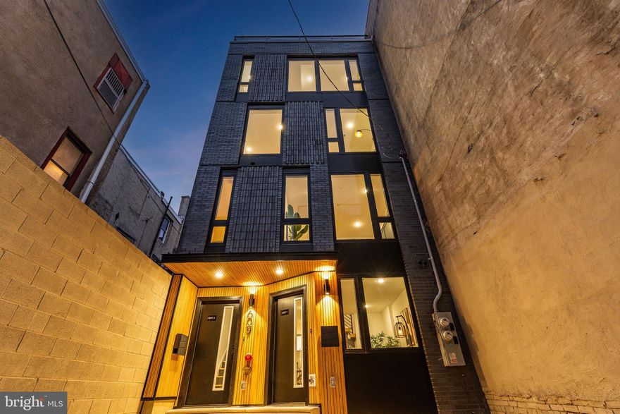 Feast your eyes on 609 South Orianna Street Unit 1, a boutique new construction home with 1 car driveway parking. Located in the heart of Queen Village, this remarkable tri-level condo is brand spanking new and has exceptionally low condos fees. Drive your car into the dedicated front driveway parking space to be greeted by an incredible modern brick façade with wood paneling. Enter Unit 1 to a completely open layout with herringbone hardwood floors and natural light pouring in from the new massive Andersen windows. The brand-new kitchen comes with quartz countertops, stone backsplash, stainless steel Samsung appliances, under cabinet lighting and so much more. Convenient half bath located on the main floor just off the kitchen. Head downstairs to your finished basement featuring almost 10-foot ceilings, a walk-in closet, and luxury vinyl plank floors. Just off the basement bedroom is a gigantic private ensuite bathroom with 84-inch double vanity, massive shower with large format tile and bench plus a rain head shower, and private toilet area. Head up to the second floor on your beautiful floating staircase with custom stained 4-inch-thick wood treads. Stackable Samsung washer and dryer sit just atop the 2nd floor staircase. The upper floor features a bedroom in the rear with a large closet and a private ensuite balcony. The primary bathroom has a custom made floating double vanity, large tub, and gorgeous mosaic tile throughout. The primary bedroom is very spacious and comes with a large double closet, custom trim feature wall, and huge windows allowing the natural light to just pour right in.  As a bonus, there are several extra storage closets located throughout Unit 1. Both units in this two-unit condo development are separately metered for gas and electric, with central air, heat and so much more. Located in the heart of Queen Village, this home is situated in the coveted Meredith School catchment, close to Headhouse Square, bars, restaurants and coffee shops. New construction tax abatement approved and pending final amounts from the city. This bespoke condo checks all the boxes and is priced to move - book your showing today!!! One member of the owning LLC is a licensed realtor in the state of PA
