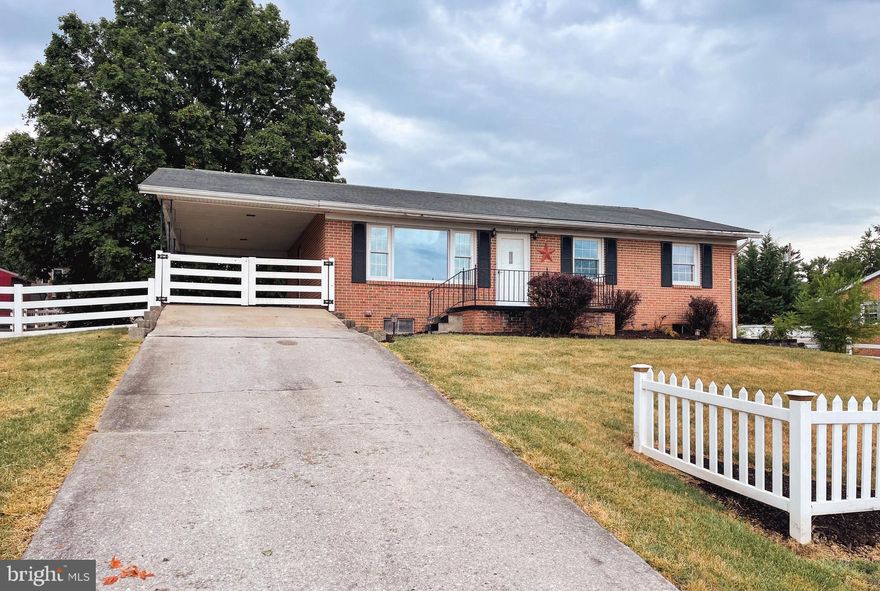 This charming all-brick ranch-style home sits on a .34-acre lot with a fenced backyard, providing both space and privacy. Conveniently located just outside the city limits, it offers easy access to local amenities while maintaining a tranquil setting. The living room is bathed in natural light, and the kitchen and dining area create a welcoming, open space. Featuring three bedrooms and 1.5 baths, the home boasts Brazilian cherry flooring in the bedrooms, hallway, and living area. Additional highlights include a full, unfinished basement, a carport, and a shed for extra storage.