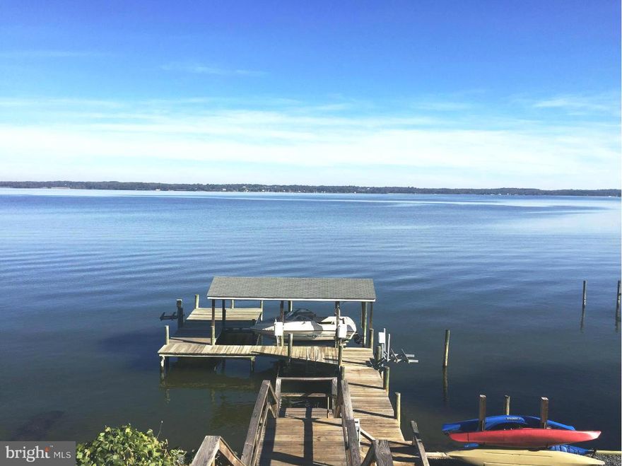 Start enjoying waterfront living today!  Beautiful expansive views from this lovely home home that features hardwood floors, granite counters, stainless appliances. Open floor plan also includes a spacious bonus room. Enjoy eating crabs on your maintenance free deck that overlooks the Patuxent River. Pier has covered boat lift and two jet ski lifts  Pool membership is available