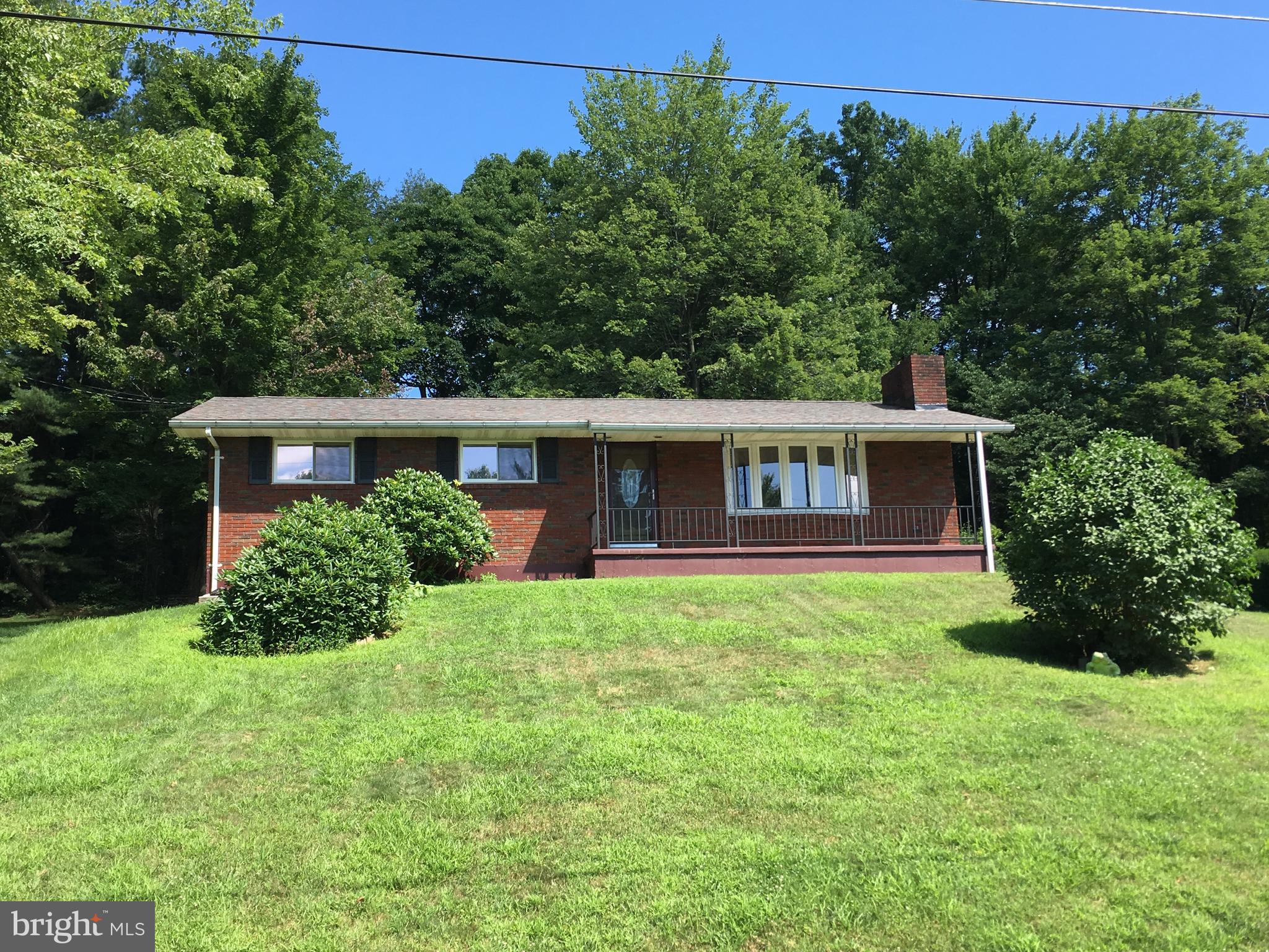Pine View Acres. 3 bedroom, 1.5 bath brick ranch home on a double lot. Replacement windows, new architectural shingle roof. Paved driveway. Concrete rear patio and shed. Central air, oil hot water heat. Partially finished basement with half bath and family room. Gas fireplace in living room. Hardwood floors under carpets. Ample closet and storage space. Laundry hookups in lower level. Basement has outside entrance.