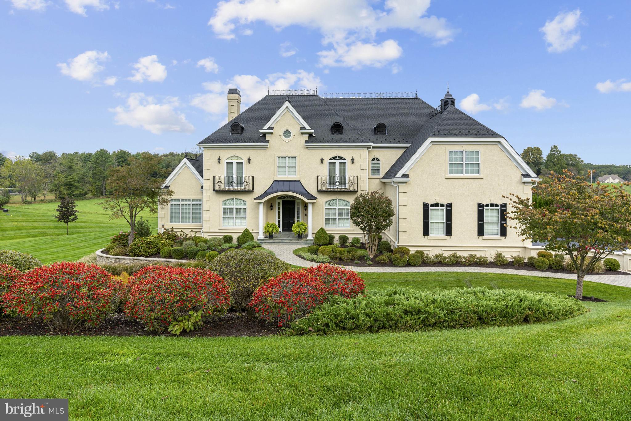 Welcome to 106 Carlton Drive in Chadds Ford, the house that has it all from luxury finishes to state-of-the-art electronics and security for your peace of mind. This home has been completely reimagined and remodeled from top to bottom by the current owners. Situated on just over 2 acres and backing to a dedicated 5 acre open space with majestic views of the rolling hills, this home offers privacy, tranquility and security features for an executive lifestyle. Seeing is believing as words and photos cannot do this home justice. Featuring 2 luxurious owner's suites with spectacular en-suite baths plus 2 additional bedrooms, both with en-suite baths, a total of 5 full baths and 2 half baths, this home has room for everyone. The main living level has every imaginable amenity: a fabulous inlaid marble entry adjacent to the formal dining room with two Schonbek Swarovski crystal chandeliers leading to the butler's pantry with custom cabinetry and venetian glass backsplash; a gourmet chef's kitchen with Sub-Zero, Wolf and Bosch appliances, an 8 burner stove, 2 dishwashers, granite countertops, over-sized pantry, radiant heat flooring, sitting room with gas fireplace and French doors to the patio and a private staircase to the upper level; a sunken family room may be the highlight of this level with a coffered ceiling, gas fireplace with real stone surround, custom millwork and archways; a conservatory with wet bar, 3rd Bosch dishwasher, Viking ice machine and beverage refrigerator is complemented with built-in cabinetry with granite countertops and custom millwork. The upper level is home to the two owner's suites with remarkable en-suite baths. The first suite includes a sitting room plus bedroom with a tray ceiling, double walk-in closets, French doors to a balcony and adjoins the first owner's bath with floor to ceiling marble walls, a double shower head, radiant heat flooring and custom cabinetry. The second suite features a coffered ceiling, 2 walk-in closets plus owner's bath with separate shower with floor to ceiling marble and whirlpool tub plus radiant heat flooring and towel warmer. There are two additional bedrooms, both with en-suite baths and walk-in closets. The upper level is completed by a laundry room with custom cabinetry, a deep broom closet plus bead board and sink plus stairs to the large attic / storage space. The lower level of this home is a sight to behold. A full walkout basement with French doors to the patio and featuring a lighted barrel-ceiling hallway with custom millwork providing access to the fitness room, executive office space or 5th guest bedroom and an unbelievable full bath with floor to ceiling marble, dry sauna, steam shower, jacuzzi whirlpool tub, radiant heat flooring and water closet. Please take special note of the custom Hunter Douglas window coverings throughout the home including Silhouettes, Luminettes, Roman Shades & Shutters. The grounds around the property are meticulously maintained and a lovely sanctuary for entertaining your guests featuring a wonderful hardscaped patio with pond and a composite deck adjacent to the family room and breakfast room. A complete list of features including highlights of the security, technology and mechanical features is available upon request but include a 22 KW GENERAC whole house generator with Mobil Link connection, two 200 AMP electric service panel boxes with surge protectors, SAVANT installed home automation and AV system, state-of-the-art closed circuit security system with Elk 48 zone alarm system, PANASONIC whole house phone system with video cameras at doors and intercom system & CARTEL driveway sensor, HAGUE whole house water system with UV light and a Baltic Leisure 8 person sauna with both dry and wet heat! PLEASE NOTE: 2021 The stucco was inspected and all repairs completed with warranty. 2021 new 50 year shingle smart roof installed.