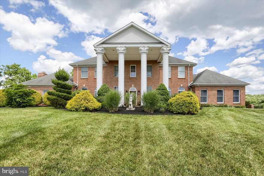 Radiating timeless elegance and unmatched luxury, this custom-built estate in Mechanicsburg offers a rare chance to own a piece of architectural genius. Nestled on 5 secluded acres in the prestigious Ford Farm neighborhood, this home promises a lifestyle of exceptional refinement and peace.
With four spacious bedrooms, each featuring its own private full bathroom, this residence provides the ultimate retreat for rest and rejuvenation. Offering 5,865 square feet, with 4 full bathrooms and 2 half bathrooms. Upon entering, you're welcomed by a unique custom staircase—a true masterpiece of craftsmanship—and abundant natural light streaming through large windows and doors, accentuating the home’s grandeur and elegance. The grand 36 x 22 great room, with its hardwood floors, stunning fireplace, and 24-foot-high ceiling, sets the perfect stage for both intimate gatherings and lavish celebrations. A versatile second-floor bonus room, a formal office with hardwood floors, 10-foot ceilings, and a wet bar, offer luxurious spaces to work and relax. The elegant staircase leads to the third floor, where you'll find a dreamlike private tower room.
The family room, located just off the kitchen, features 10-foot ceilings, large windows, and a charming fireplace, creating a cozy yet elegant space for relaxation or entertainment. The kitchen, with its open floor plan, includes an island, a luxurious Sub-Zero refrigerator, a newer gas cooktop, double ovens, and a dishwasher. A bright breakfast room with cathedral ceilings adjoins the kitchen, providing the perfect spot to enjoy your morning coffee while watching the sunrise. The laundry/mudroom connects to an expansive 5-car garage. Outside, your private oasis awaits, complete with a 6-year-old in-ground, saltwater, propane-heated pool, and a vast yard ideal for outdoor entertaining or serene relaxation. The immense three-tiered Trex deck (also 6 years old) seamlessly blends indoor and outdoor living. A Goalrilla basketball hoop and paved half-court cater to the sports enthusiast, while a designated fenced garden offers a haven for gardeners. The horseshoe driveway and 5-car garage provide convenience and ample parking. The home also features two newer heat pumps (2017 and 2022) and a newer grinder pump (2019).
Located on 5 private acres yet minutes from town, this residence offers the ideal balance of seclusion and accessibility. Close to the Yellow Breeches and major highways, it provides a peaceful retreat from the daily grind while still being within easy reach of all amenities—truly an unbeatable location.
Experience the pinnacle of luxury living in this impressive presidential-style brick home.  Don’t miss your chance to own this extraordinary property.