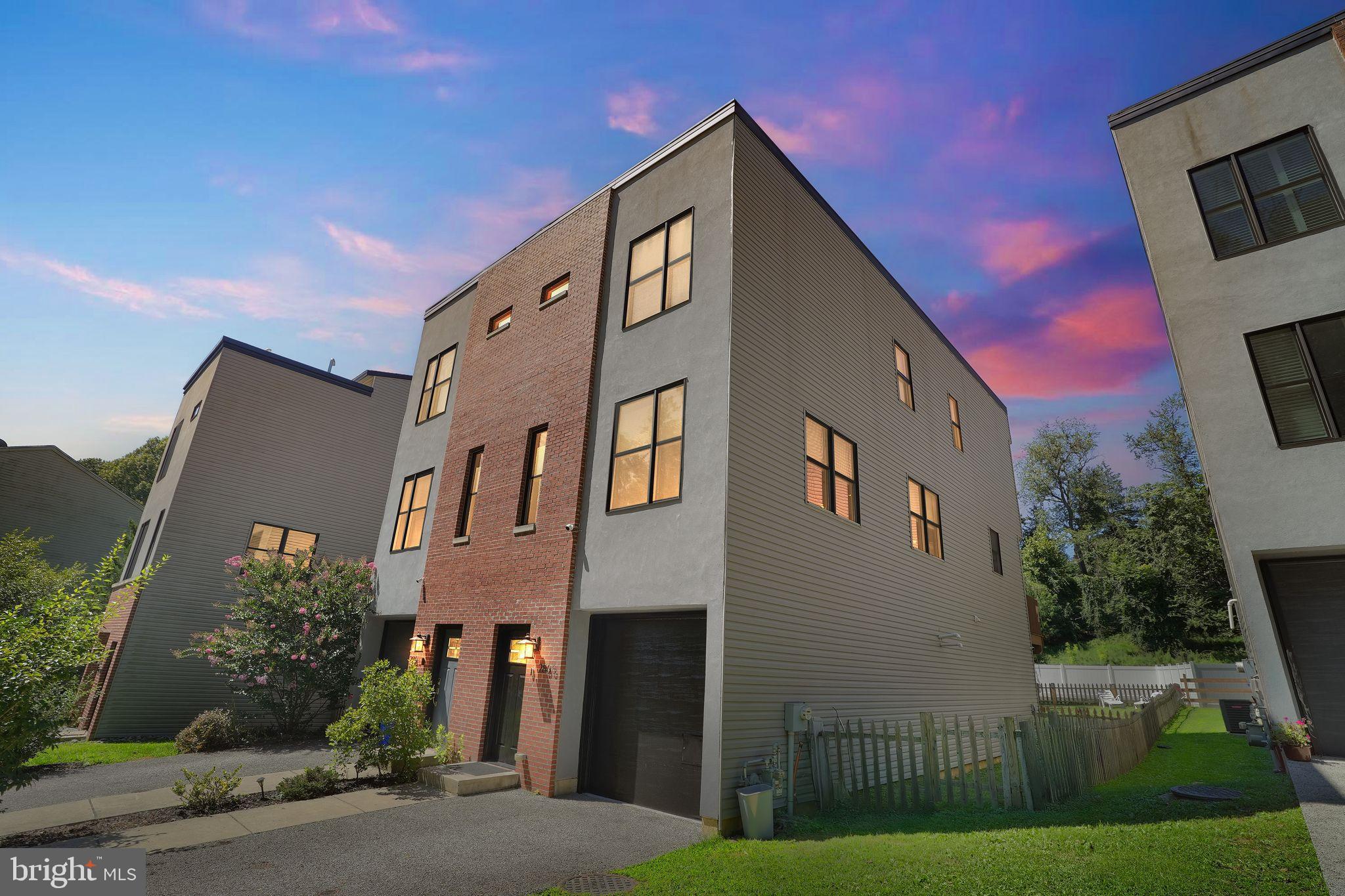Immaculate three-bedroom twin home offering three levels of modern living, ideally located near the Ivy Ridge train station, Schuylkill River Trail, and Main Street Manayunk. This spacious residence features an open-concept floor plan filled with natural light and three private outdoor spaces: a lower-level patio, a kitchen deck, and a rooftop deck with stunning views. The entry level includes a welcoming foyer with coat closet, a full bathroom, and a versatile bonus room—perfect for a home office, gym, or guest suite. The main level boasts a bright living room and a stylish open kitchen with stainless steel appliances, a large island, peninsula and direct access to the deck. Upstairs, you’ll find three well-sized bedrooms and two upgraded full bathrooms, including an Owner’s Suite with a spa-like ensuite. Additional highlights include custom pantry and bult-ins, an attached one-car garage and driveway parking. Don’t miss this exceptional home—schedule your showing today!